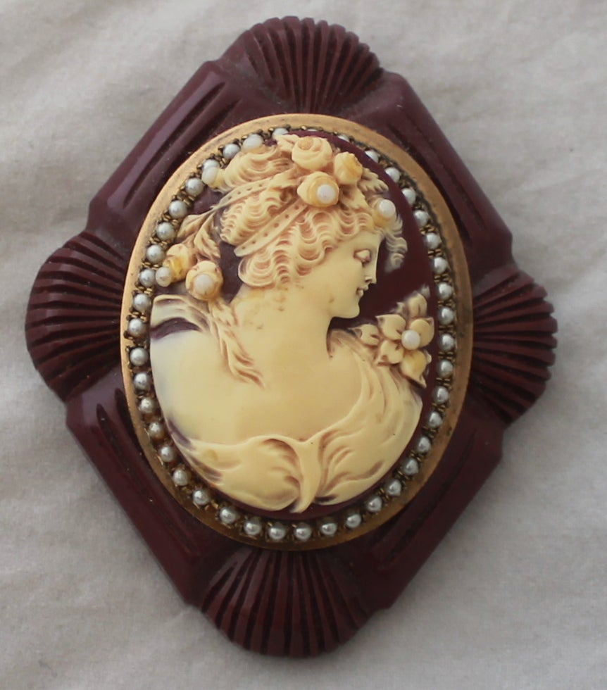 1980's Vintage Mahogany Carved Wood Cameo Pin with Pearls. This pin is in very good condition with some wear on the cameo design due to age. 

Length- 3
