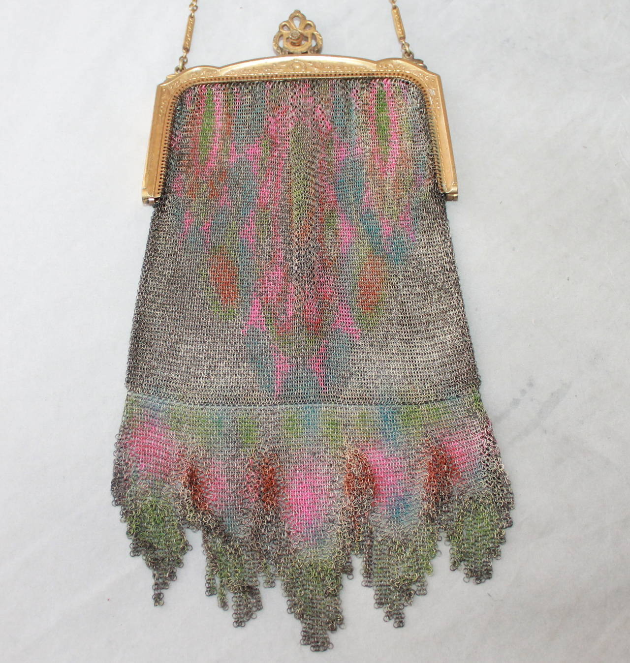 Edwardian Vintage Whiting & Davis Dresden Multi-Color Mesh Bag. This bag is in excellent vintage condition with a fringe-look on the bottom. The hardware is starting to show minor dark spots due to it being so old. 

Height- 7.5