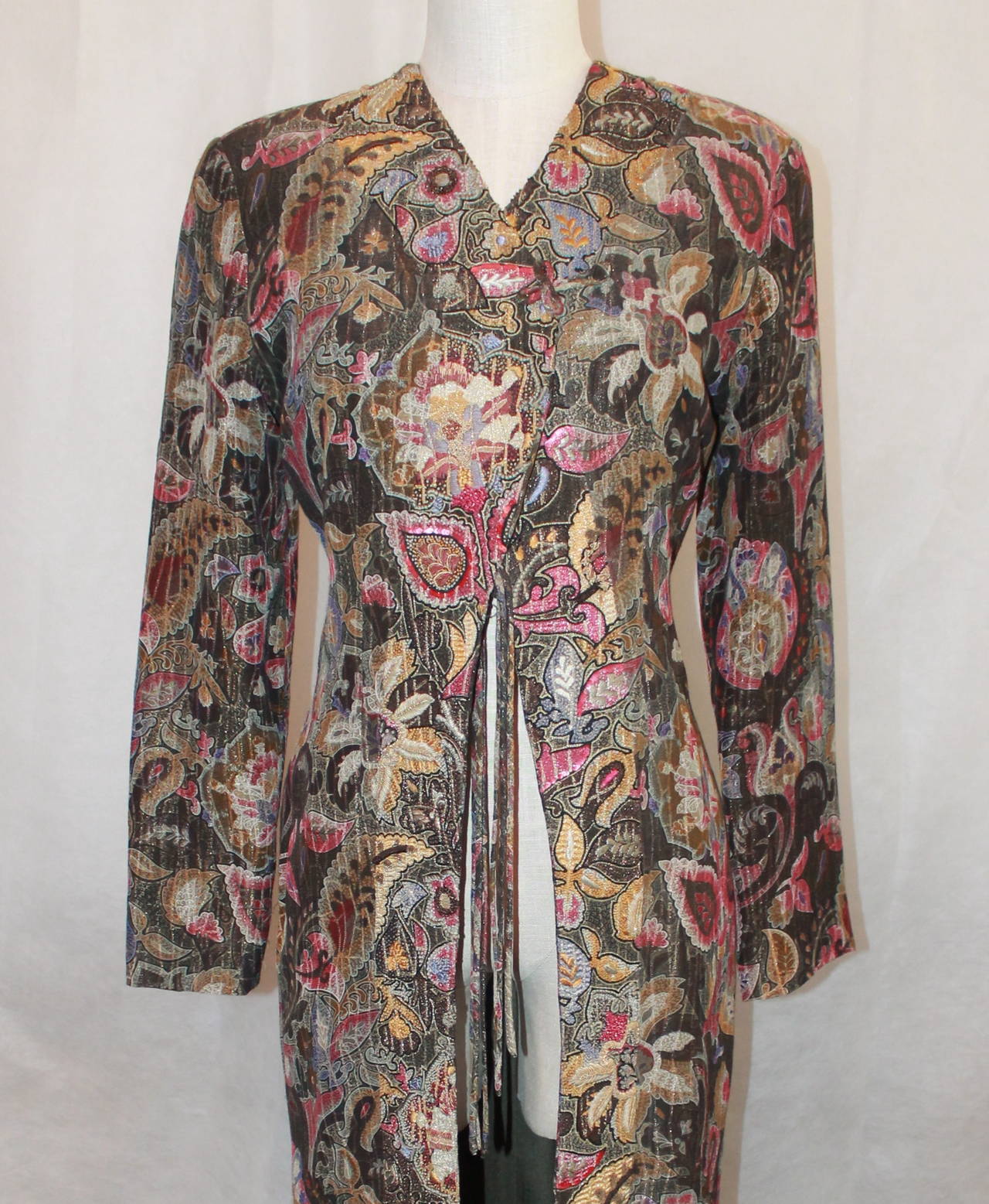 Armani 1990's Vintage Multi-Color Brocade Paisley Embroidered Coat - 40. This coat is in excellent condition with very light wear. It is long sleeved and shimmery with embroidery on the middle and sequins. 

Measurements with coat closed:
Bust-