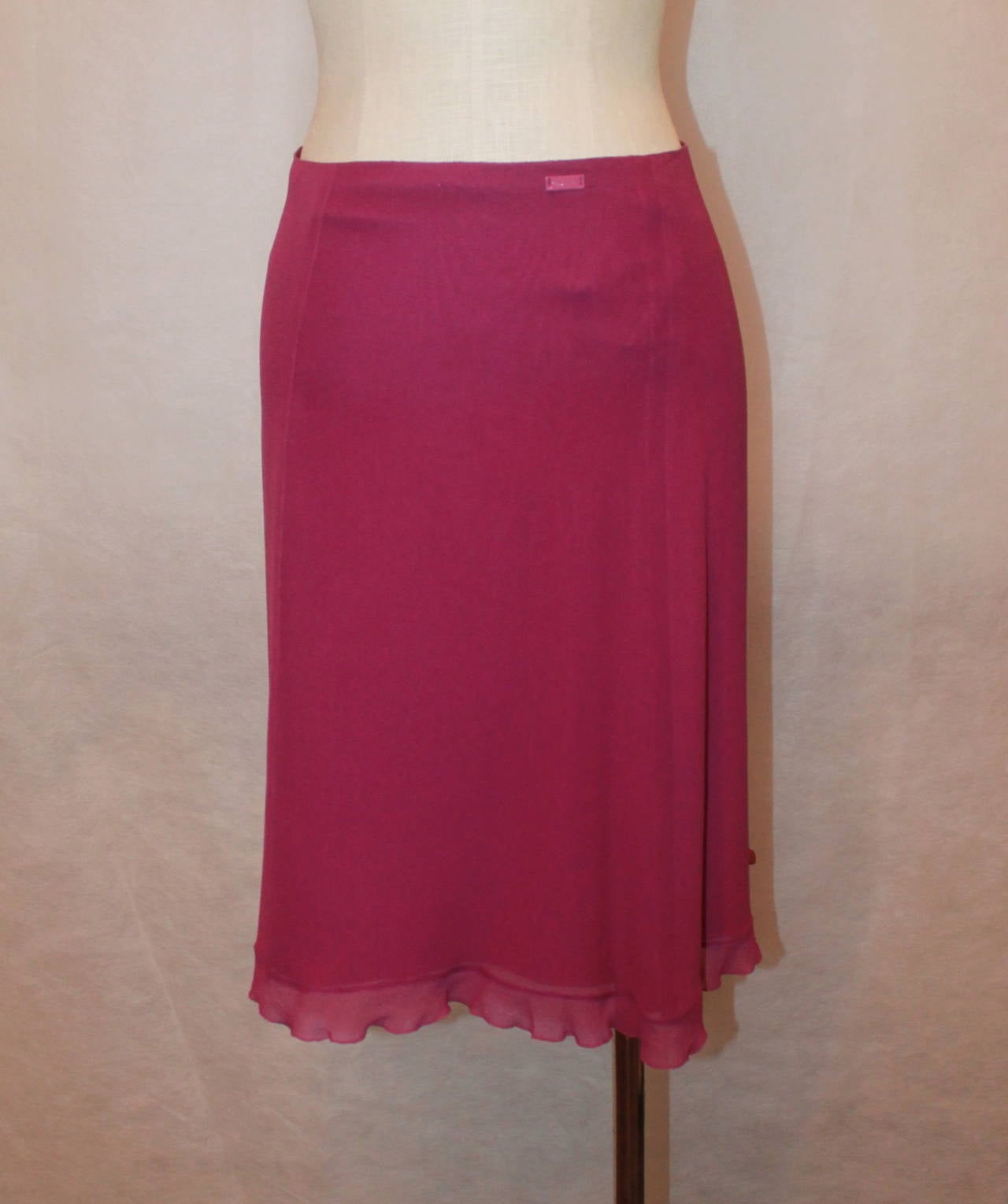 Chanel 2001 Raspberry Silk Chiffon Skirt with Bottom Ruffle - 38. This skirt is in very good condition with 1 small pull in the back top. 

Waist- 29