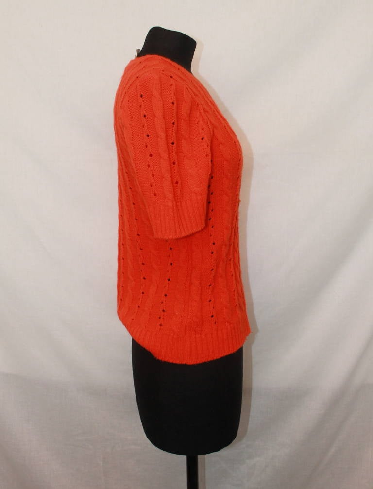 Courreges Vintage Orange Crewneck Top - M. This sweater-top is from the 1970s and in excellent condition. 

Measurements:
Bust- 32"
Shoulder to Shoulder- 15.5"
Waist- 32"
Sleeve Length- 10"
Length- 22"