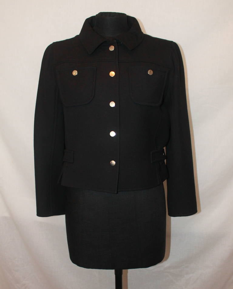 Courreges Black Wool Jacket - 38. This jacket is in impeccable condition. We have a matching black wool dress & skirt in stock.

Measurements:
Bust- 28