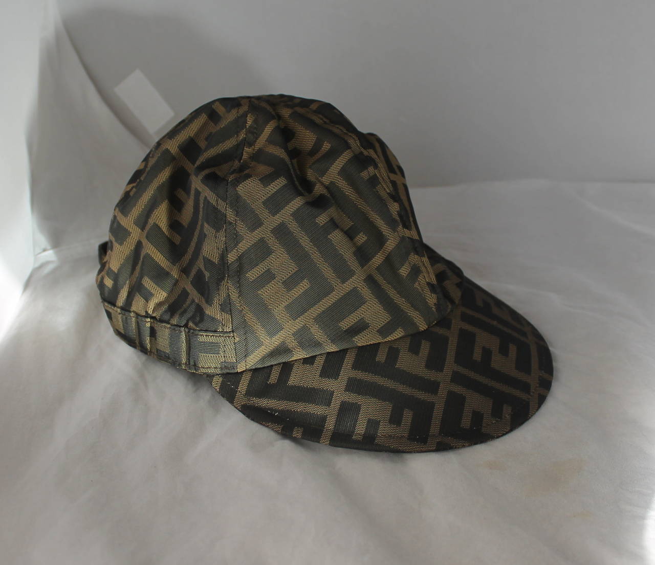 Fendi Monogram Printed Baseball-Style Cap. This cap is in very good condition with light use. It is adjustable up to 23