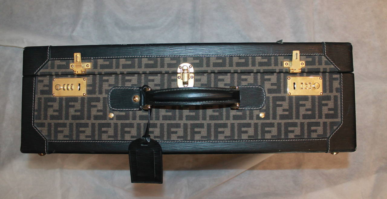 Fendi Monogram Print & Epi Leather Trim Hard Suitcase - GHW. This suitcase is in fair condition with visible use seen in images 3-7. The hardware is losing its sheen, 2 areas of the epi leather are torn, there are scuffs along the trimming, a white