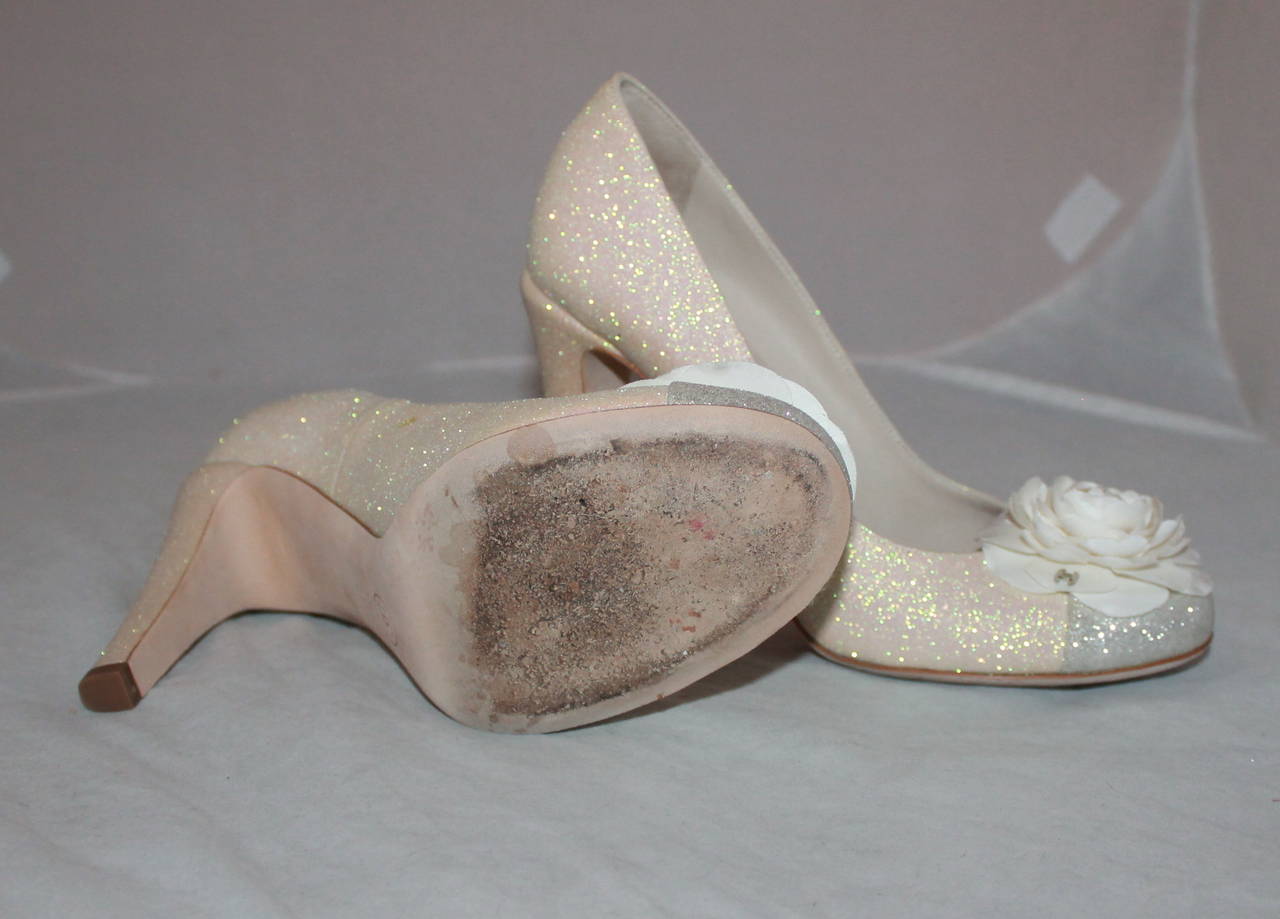 Chanel Ivory & Silver Glitter Pumps with Front Camellia - 40 In Excellent Condition In West Palm Beach, FL