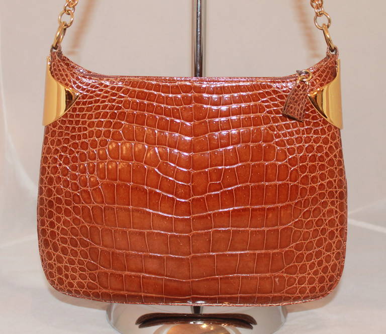 Gucci Brown Crocodile Shoulder Bag. This bag is in impeccable condition and comes with a duster. 

Measurements:
Height- 9