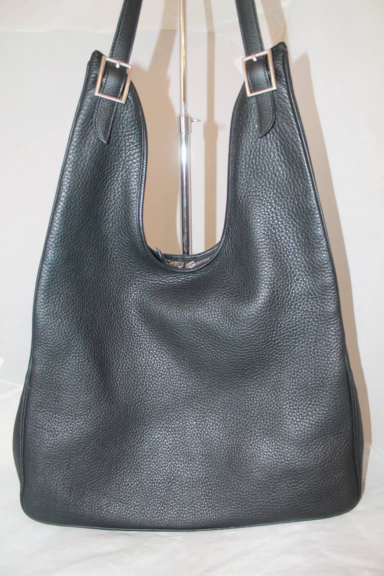 Hermes Black Massai Handbag - PM. This Hermes handbag is in impeccable condition and comes with a duster. 

Measurements:
Depth- 2.5