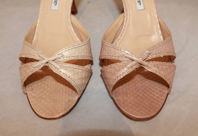 Manolo Blahnik Creme Snake Heels - 6.5. These shoes are in excellent condition with minor wear on the bottom of the shoes.