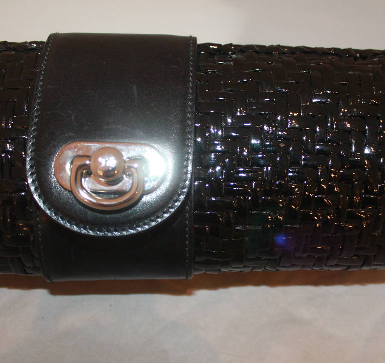 Ralph Lauren Collection Black Clutch. This painted straw clutch is in impeccable condition with an authenticity card included.

Measurements:
Height- 4