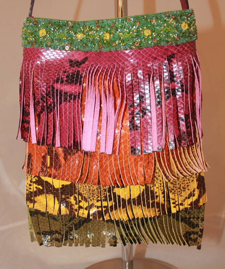 Etro Multi-Color Python Fringe Handbag. This handbag is in impeccable condition. It has pink, orange, yellow, and green python fringes with beading on the top. 

Measurements:
Height- 10.75