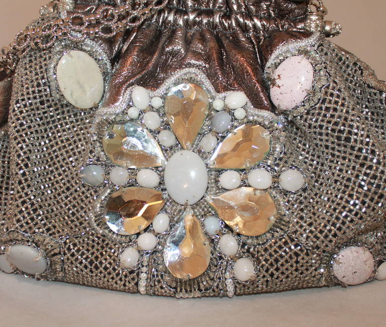Larisa Barrera Metallic Beaded Handbag. This handbag is in impeccable condition with a mesh, stones, and beading and embroidery on the front. 

Measurements:
Height- 11