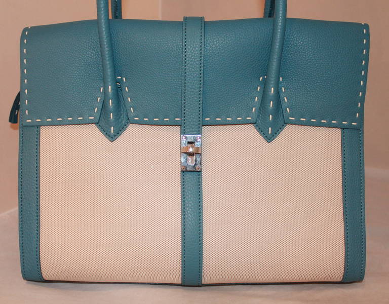 Nagatani Blue Jean Leather & Canvas Tote. This bag is in impeccable condition and has never been worn. 

Measurements:
Height- 11