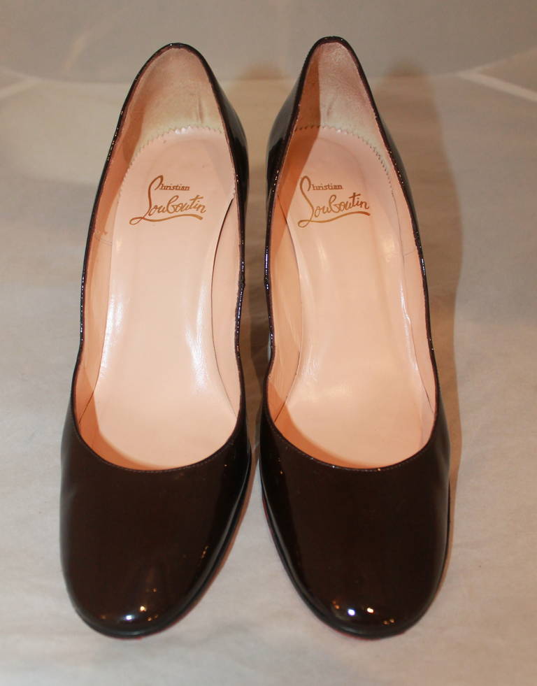 Christian Louboutin Brown Patent Pumps- 8.5. These shoes are in impeccable condition with very minimal markings.