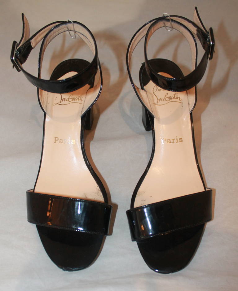 Christian Louboutin Black Patent Sandals- 38.5. These shoes are in excellent condition with minimal markings. They have visible wear on the bottom.