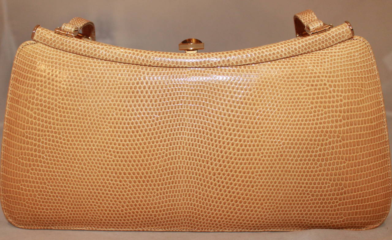 Judith Leiber Vintage Gold Lizard Handbag with Tiger's Eye Clasp. This bag is in excellent vintage condition and comes with a coin purse. 

Measurements:
Length- 4.5