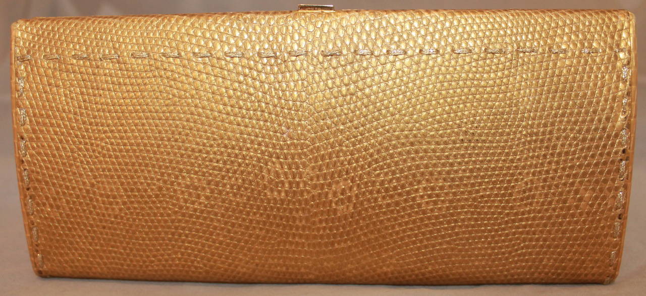 VBH Gold Lizard Clutch. This clutch is in excellent condition and has a visible minor stain on one side seen on image 4. 

Measurements:
Length- 4