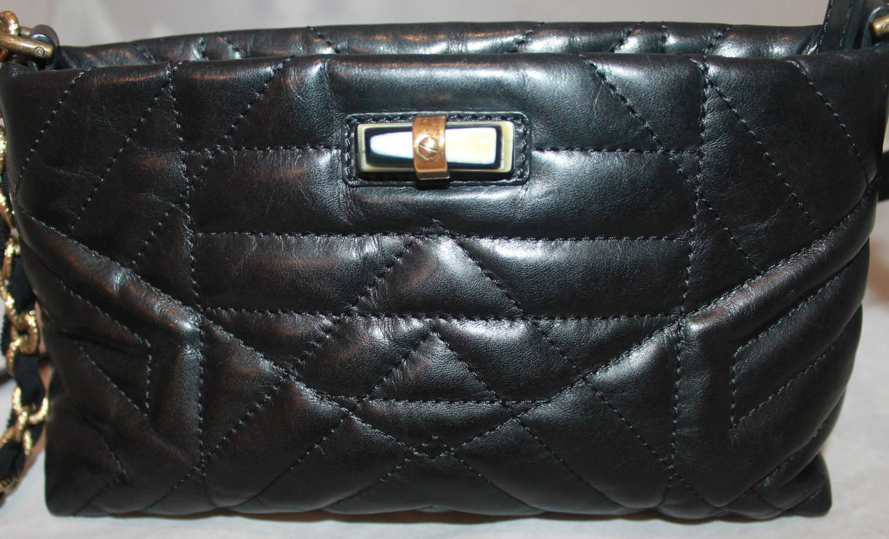 Lanvin Black Quilted Leather Cross Body Handbag. This bag is in impeccable condition. The strap is removable and the bag can be worn as a clutch. 

Measurements:
Length- 5