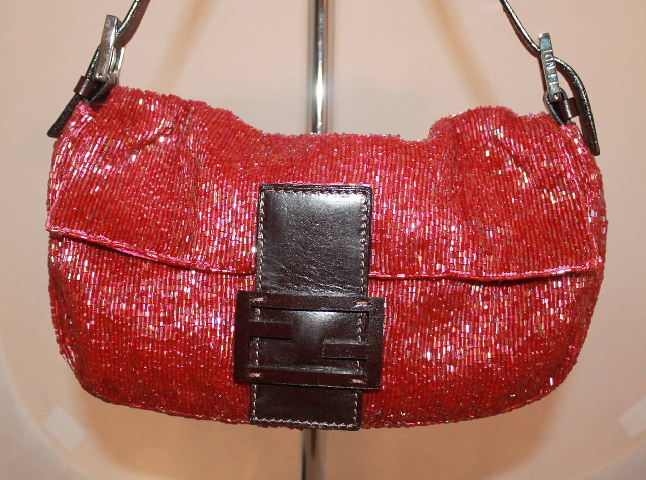 Fendi Raspberry Beaded & Leather Baguette. This bag is in excellent condition. 

Measurements:
Length- 6