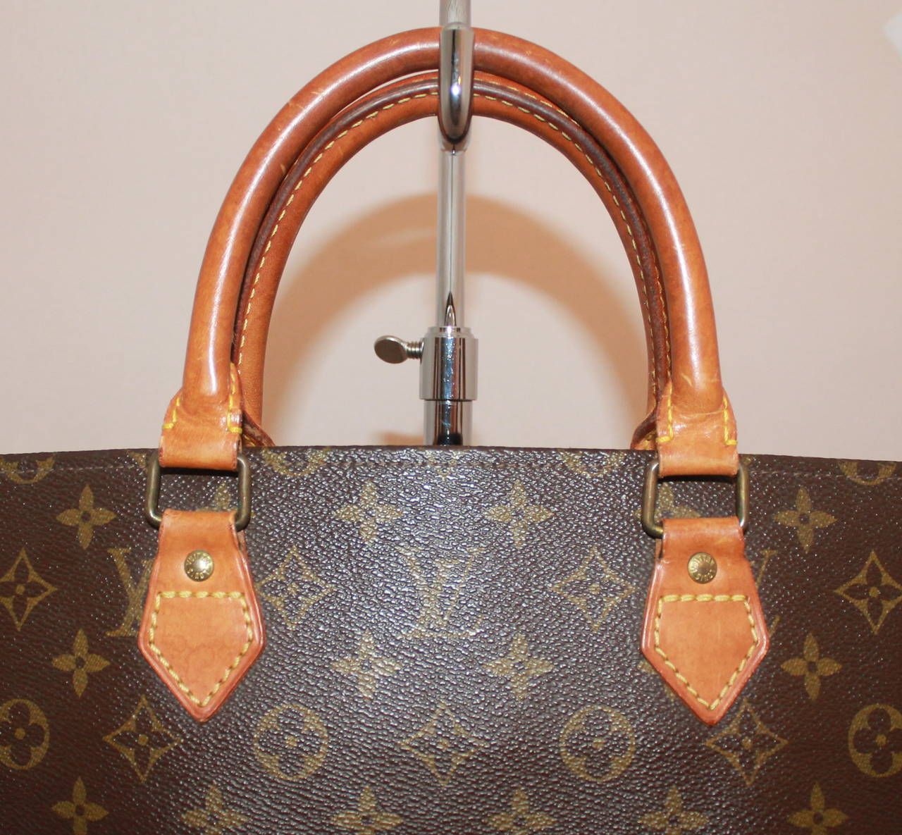 Louis Vuitton Vintage Brown Monogram Tote. This long tote is in excellent vintage condition. 

Measurements:
Length- 15.5