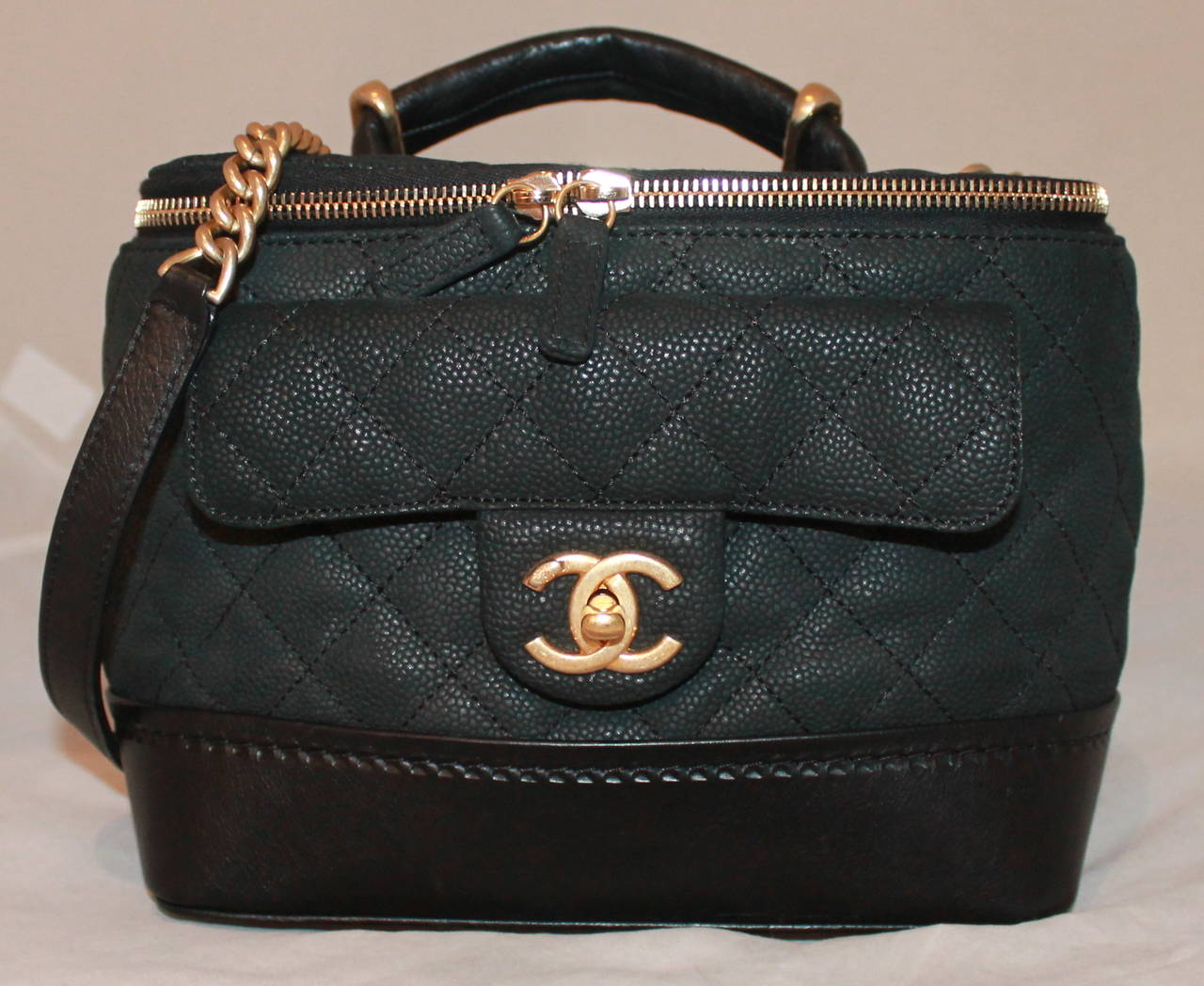 Chanel Black Leather Quilted Globe Trotter Handbag - circa 2014. This bag is in impeccable condition and comes with the box and duster.

Measurements:
Length- 7