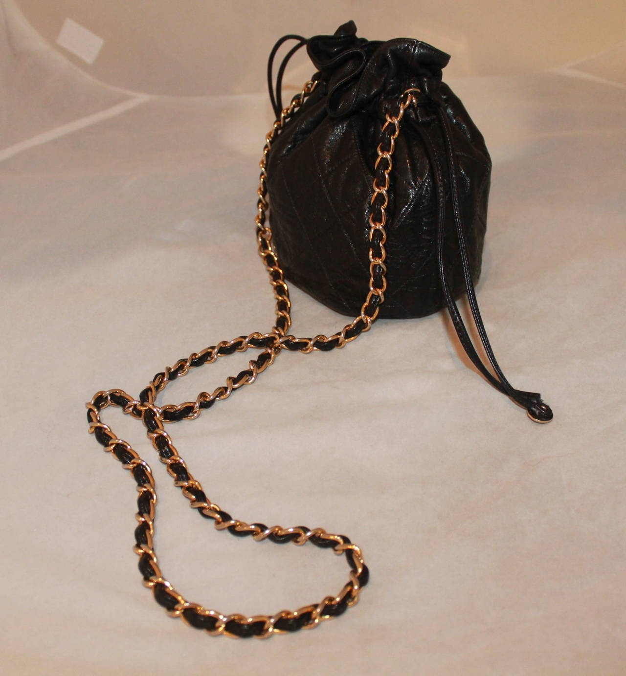 Chanel Black Lambskin Quilted Mini Drawstring Handbag - circa 1997 In Excellent Condition In West Palm Beach, FL