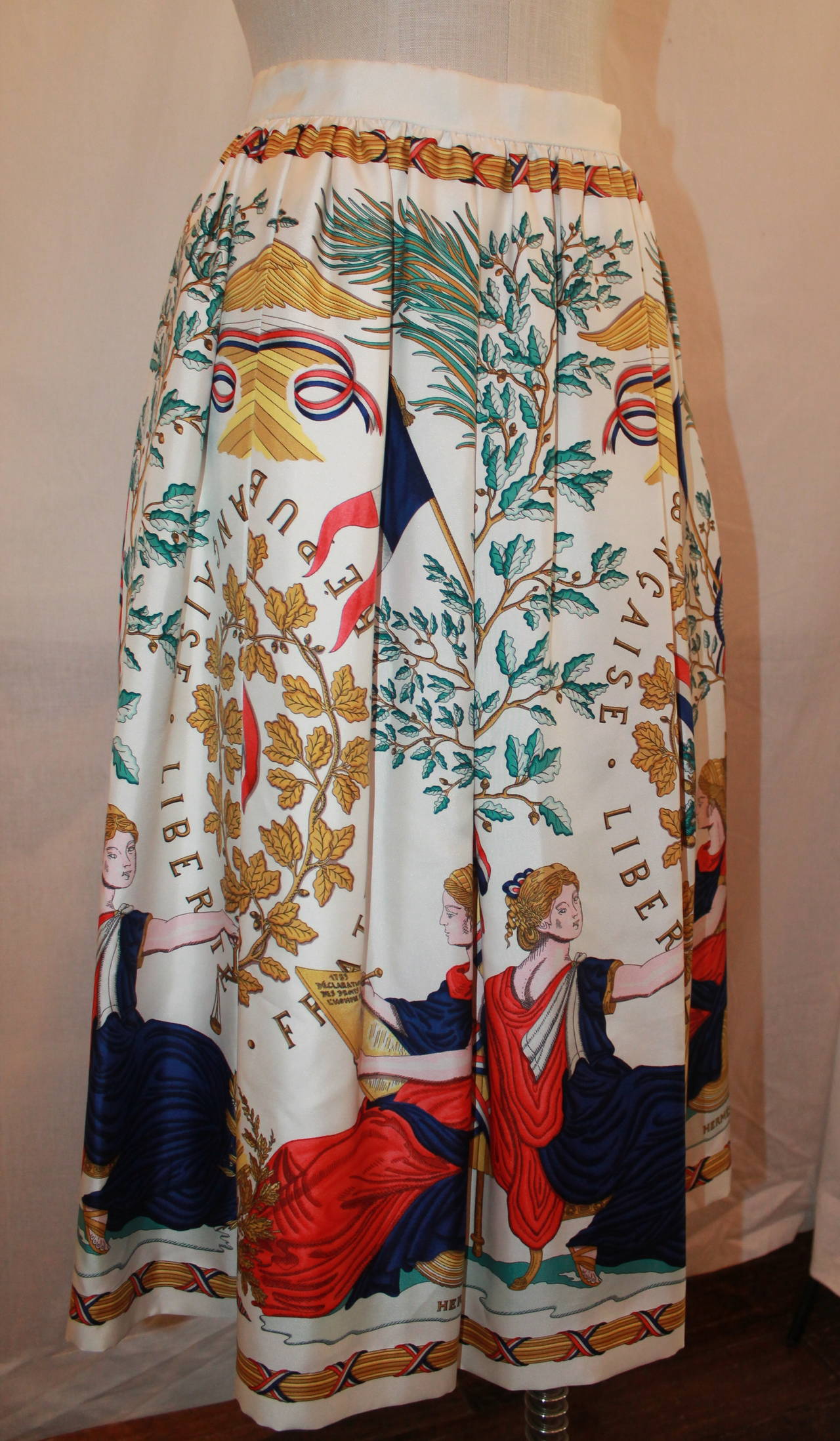 Hermes Vintage Silk Liberty Printed Skirt - circa 1990s - 34. This skirt is in excellent condition with no visible markings. It reaches to just below the knee on most. 

Measurements:
Waist- 26