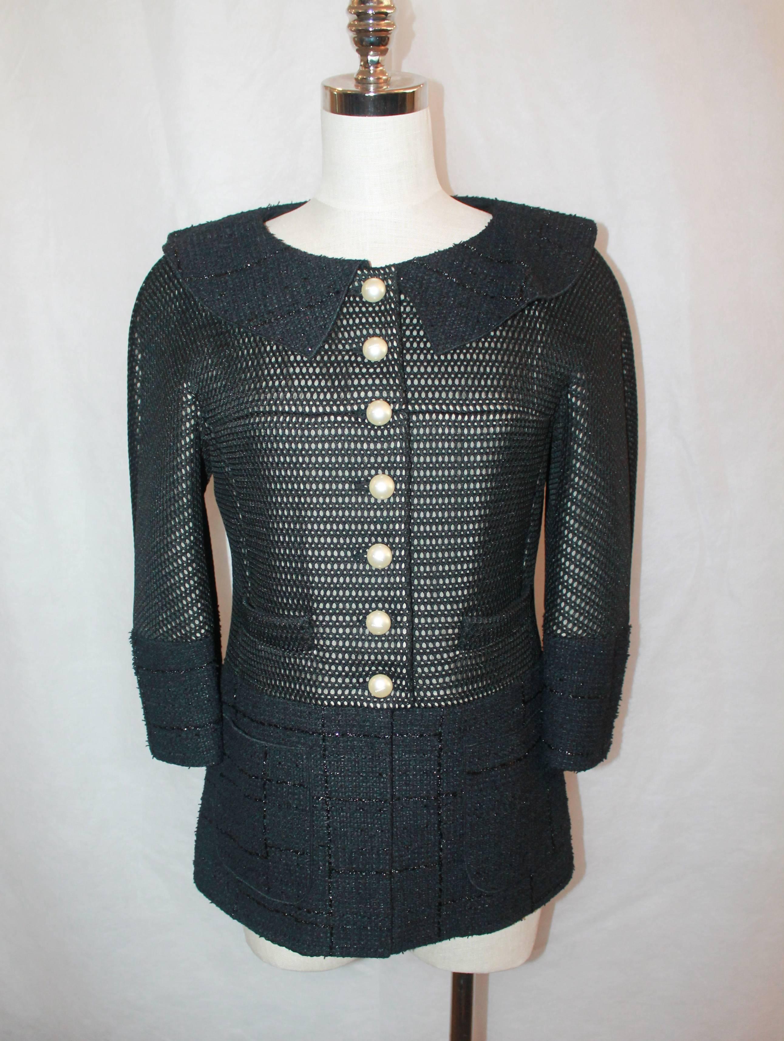 Chanel Black Eyelet and Tweed Jacket - 42

This Chanel Jacket is in excellent condition. It is eyelet with a tweed collar, cuffs, and bottom. The buttons are pearl and have 