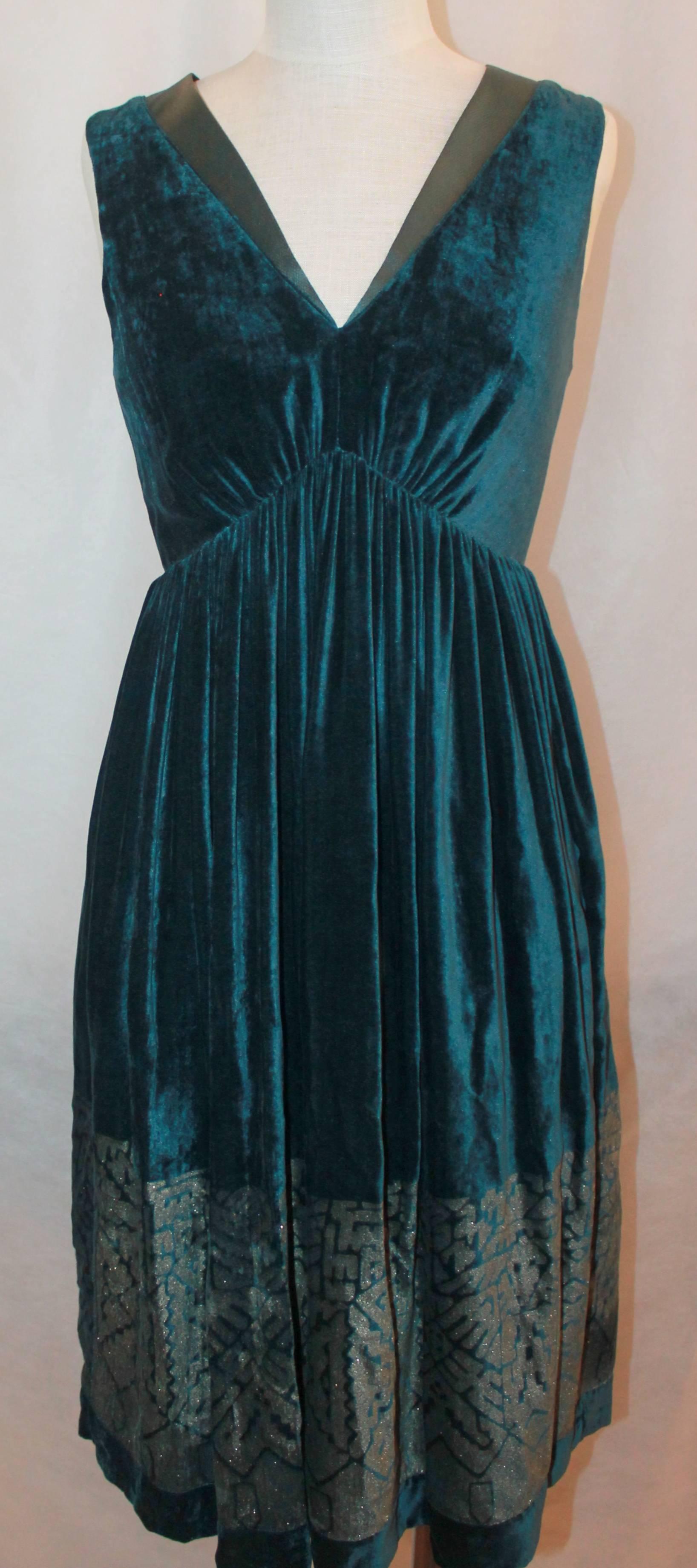 Etro Teal Velvet Dress - 40

This Etro Velvet Dress is in excellent condition with a glitter geometric print on bottom of dress and a satin neckline. There is also a matching Bolero to go with dress. Sold separately in store.