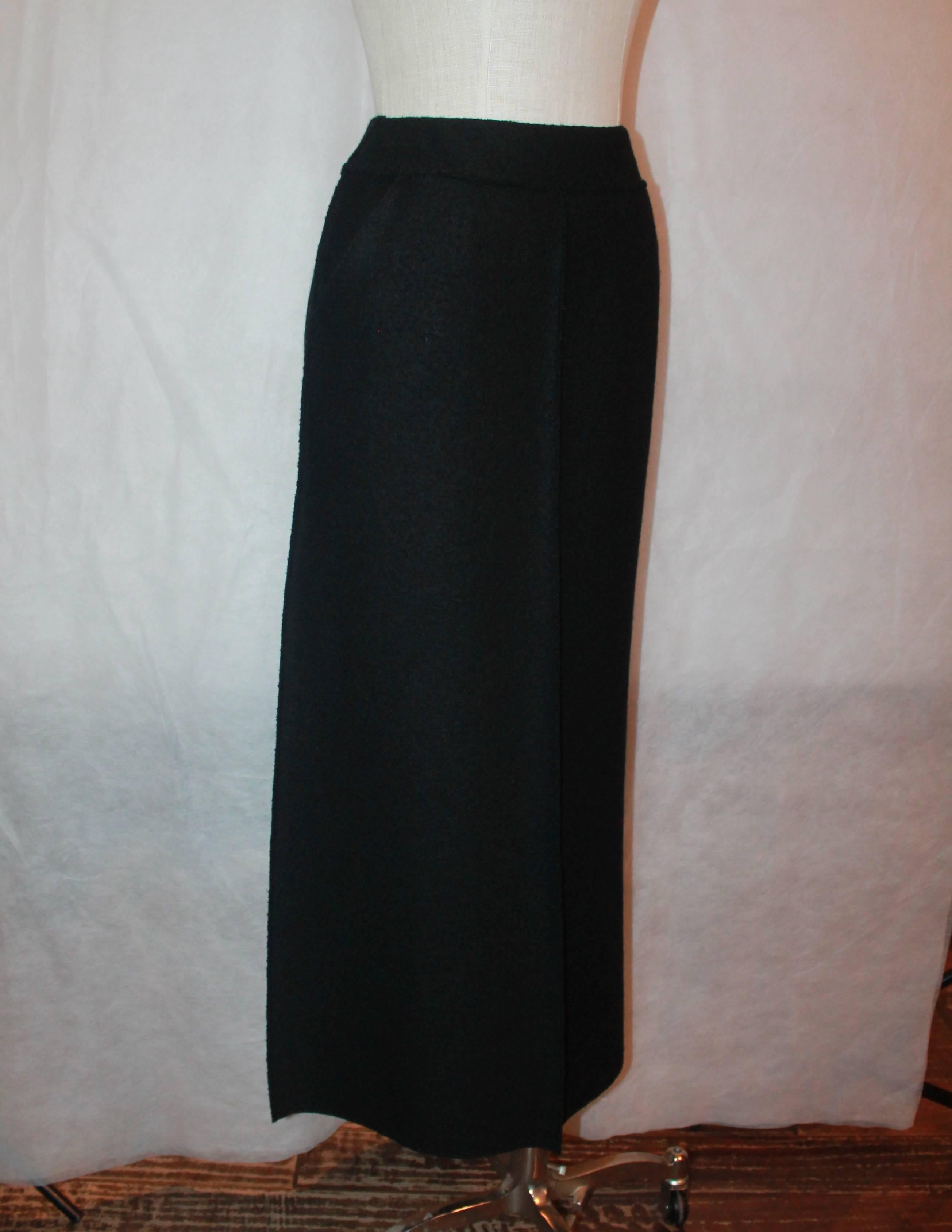 Chanel Black Wool Vintage Maxi Skirt w/ Buttons Down Back - 36 - 1999.  This vintage skirt features two side pockets and a front center pleat.  It has black 
