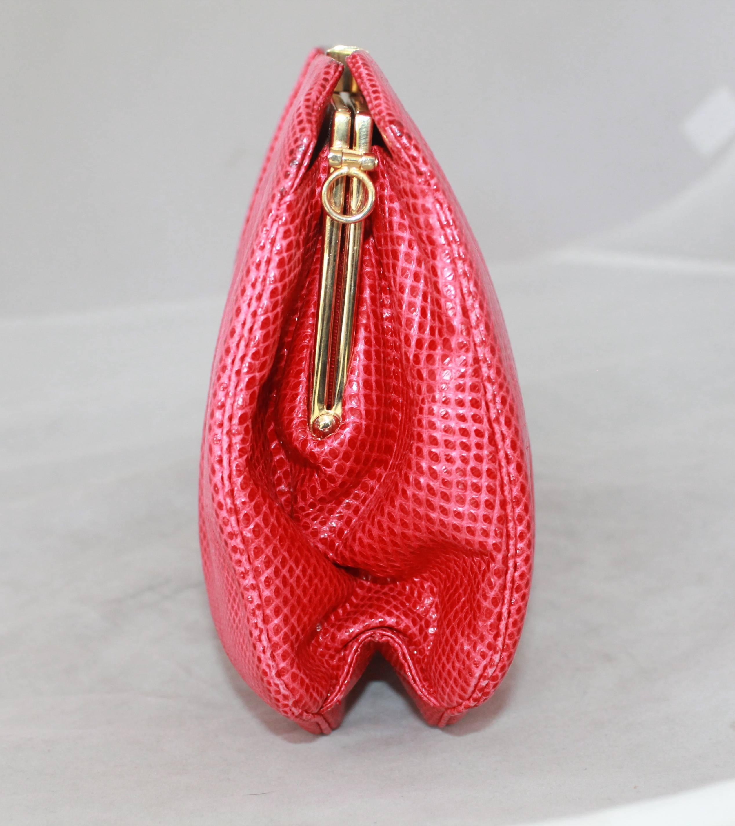 Judith Leiber 1970's Vintage Red Karung Snake Square Evening Bag.  This bag is in good condition with minor wear on the bottom consistent with its age and one noticeable stain on the front left corner.  It comes with a duster, removable strap, and