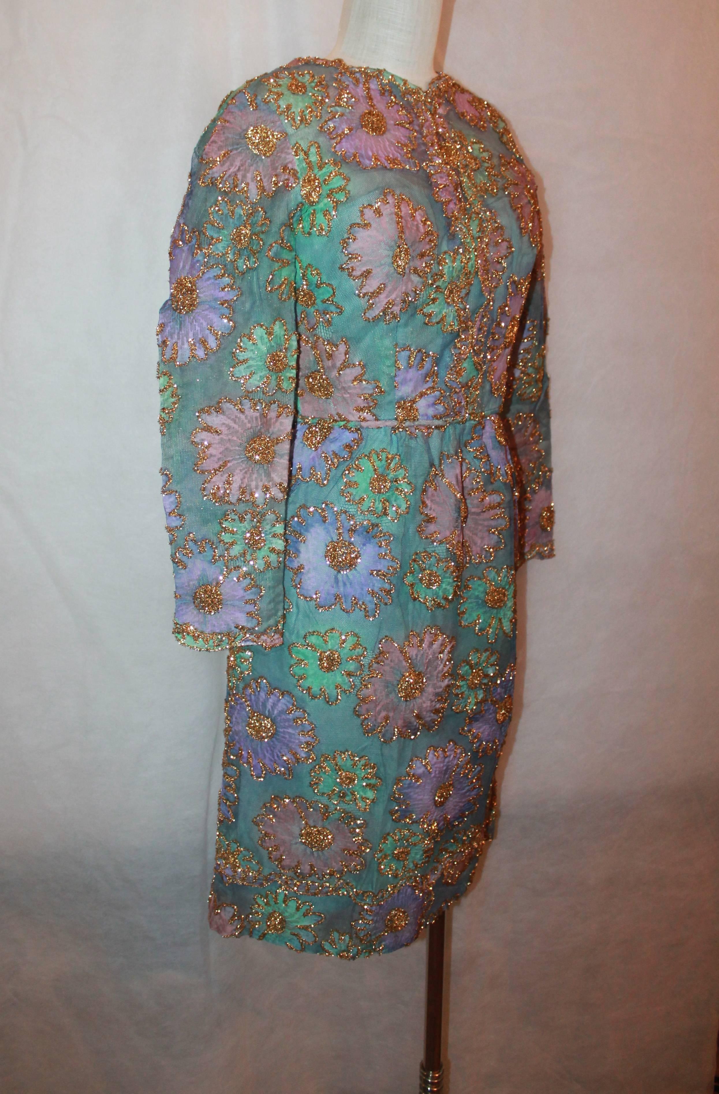 Sarmi 1960's Pastels Lace & Tinsel Long Sleeve Dress - M. This dress is in excellent vintage condition and has a slip. It has aqua, pink, purple floral lace with gold tinsel trim. 

Measurements:
Bust- 36"
Shoulder to Shoulder-