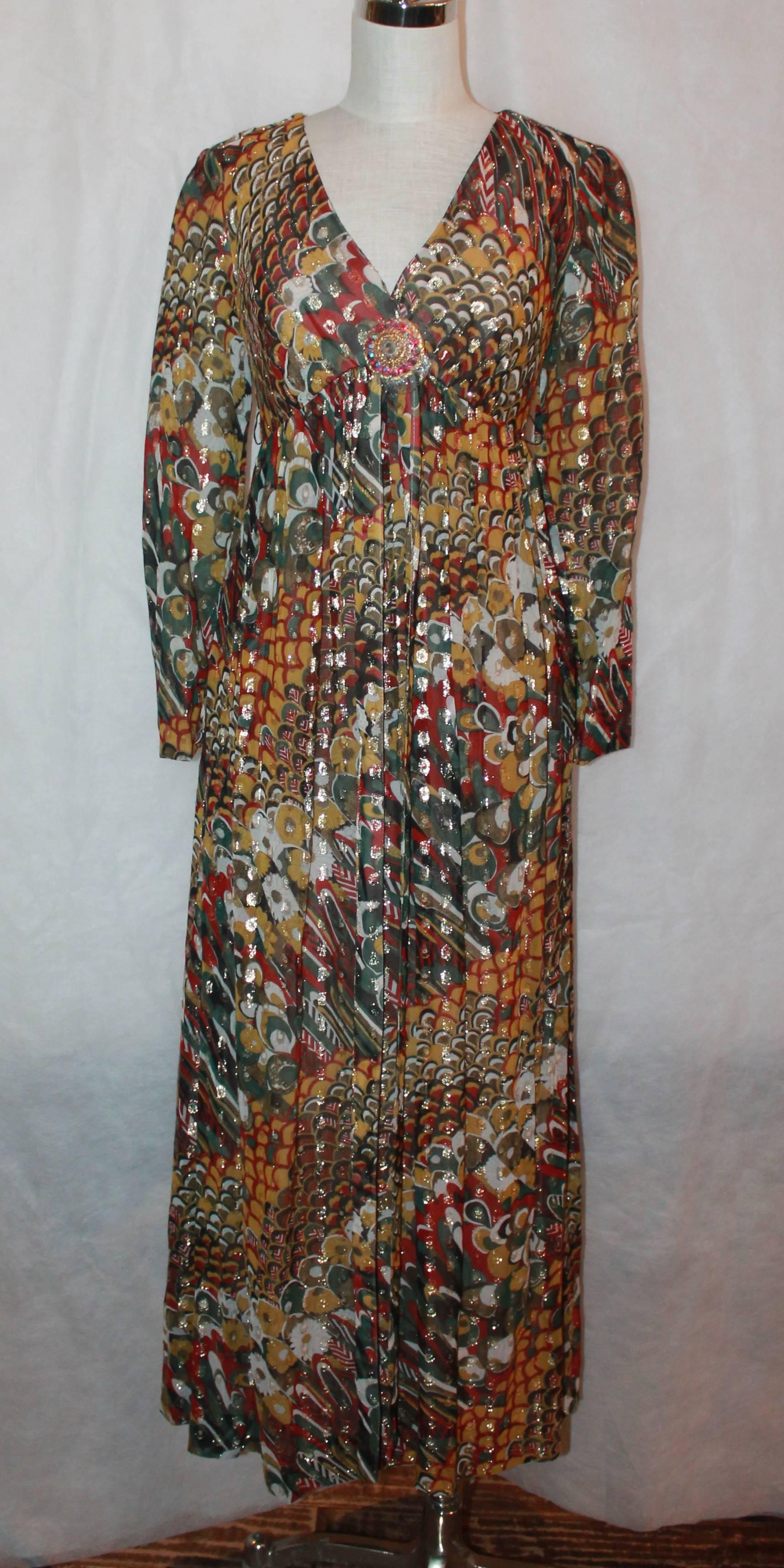 Adele Simpson 1950's Vintage Multi Mod Brocade Long Sleeve Dress - 8.  This long sleeve mod brocade dress features a rhinestone gold brooch with yellow, green, and red stones.  This dress is in excellent condition.  

Measurements:
Bust: