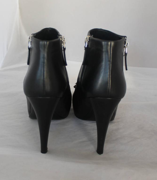 Women's Chanel Black Leather Heeled Booties with Front Camellia - 40 For Sale