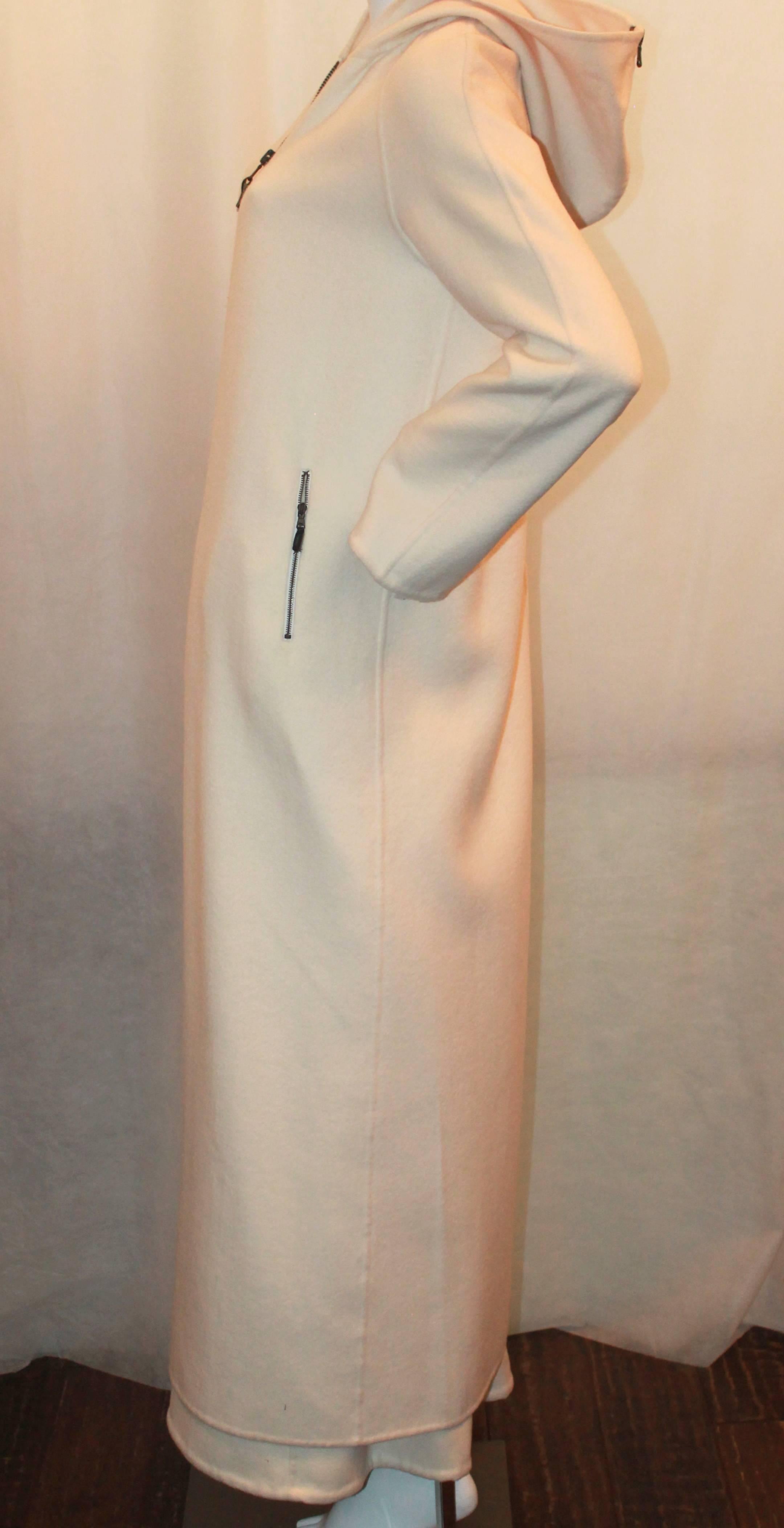 Michael Kors 1990's Vintage Ivory Cashmere Coat & Maxi Skirt Set - L. These one-of-a-kind pieces are in excellent vintage condition. The full length coat has a matching full length skirt. There are 2 front zip pockets on both the coat & the skirt