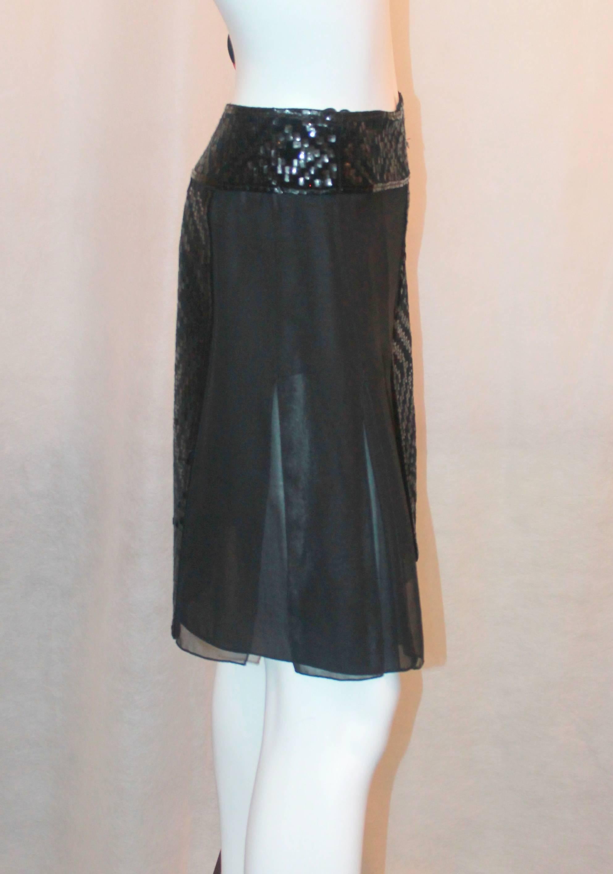 J. Mendel Black Silk Skirt with Sequin Panels - 8. This skirt is in excellent condition and has a 2 layer carwash pleat. There is a Velvet and sequin design on the waistband and the front & back panels. 

Measurements:
Waist- 28.5