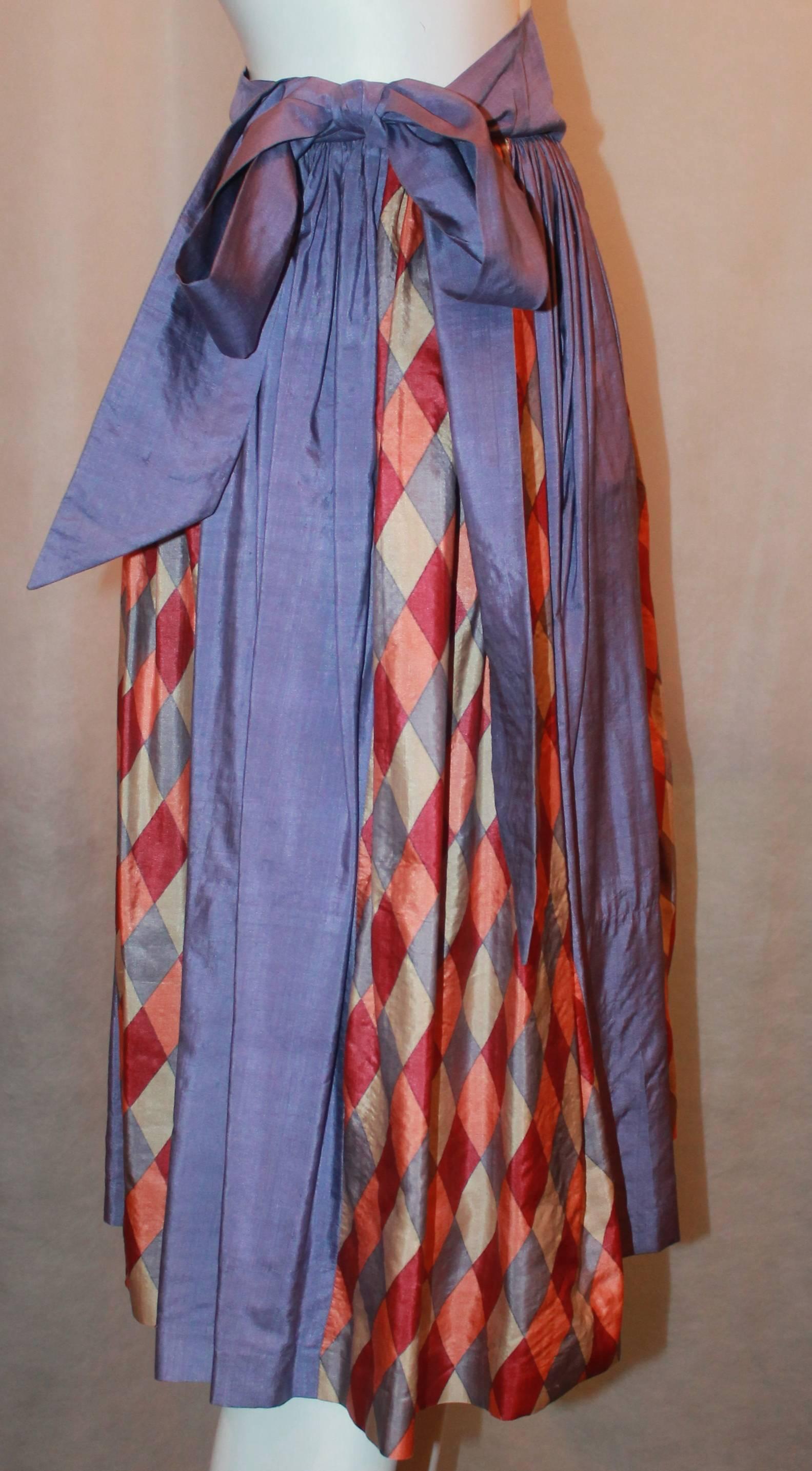 YSL Rive Gauche 1970's Lavender Silk Mid Length Skirt w/ Diamond Print - 36.  This vintage skirt is in very good condition, with no flaws other than wear consistent with its age.  It has vertical stripes alternating between solid purple and a