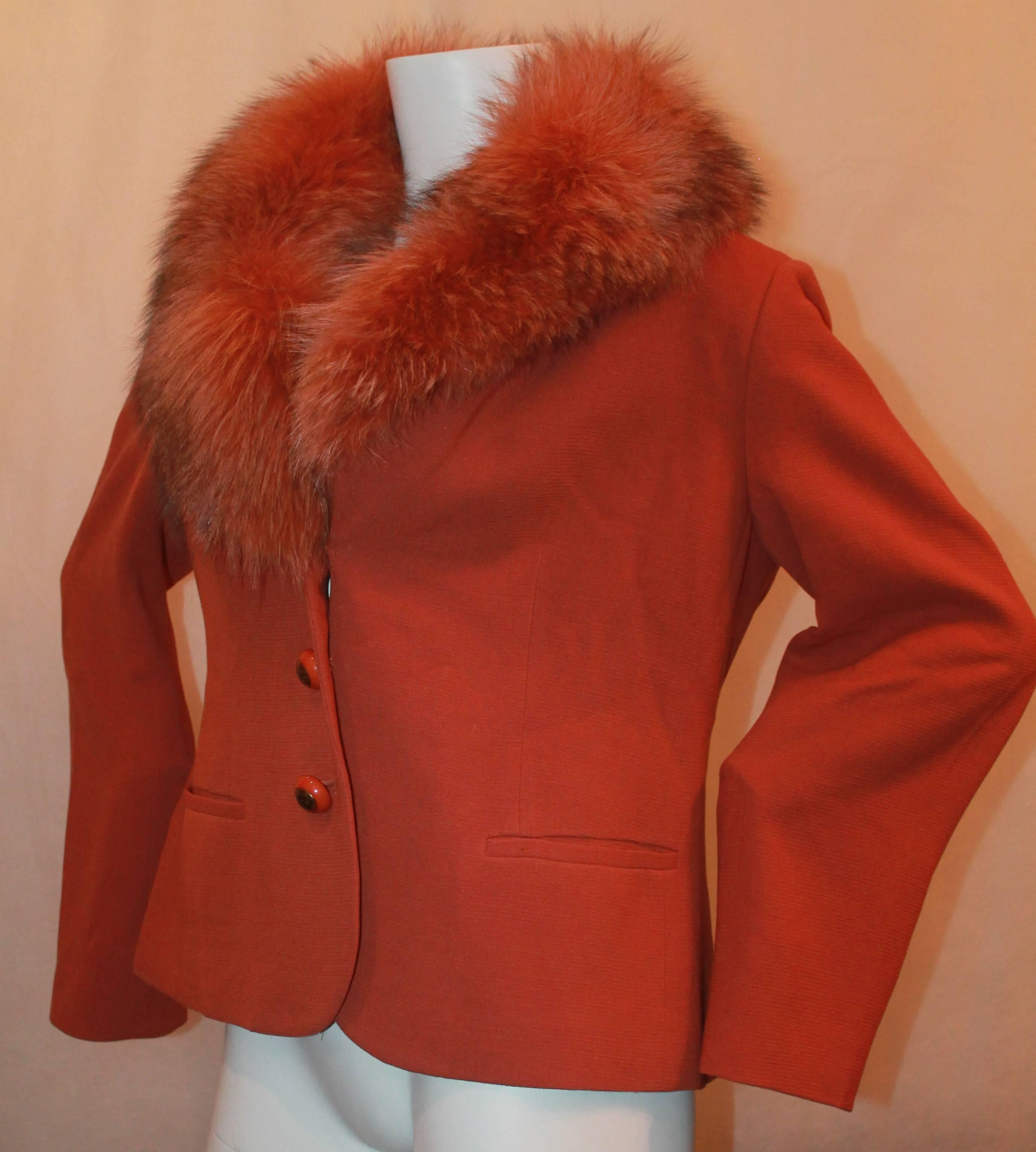 Agnona Burnt Orange Wool Jacket w/ Fox Collar - 30.  This jacket is in excellent condition.  It features a beautiful orange fox fur collar, three orange and gold buttons, and two shallow pockets.  The collar is not