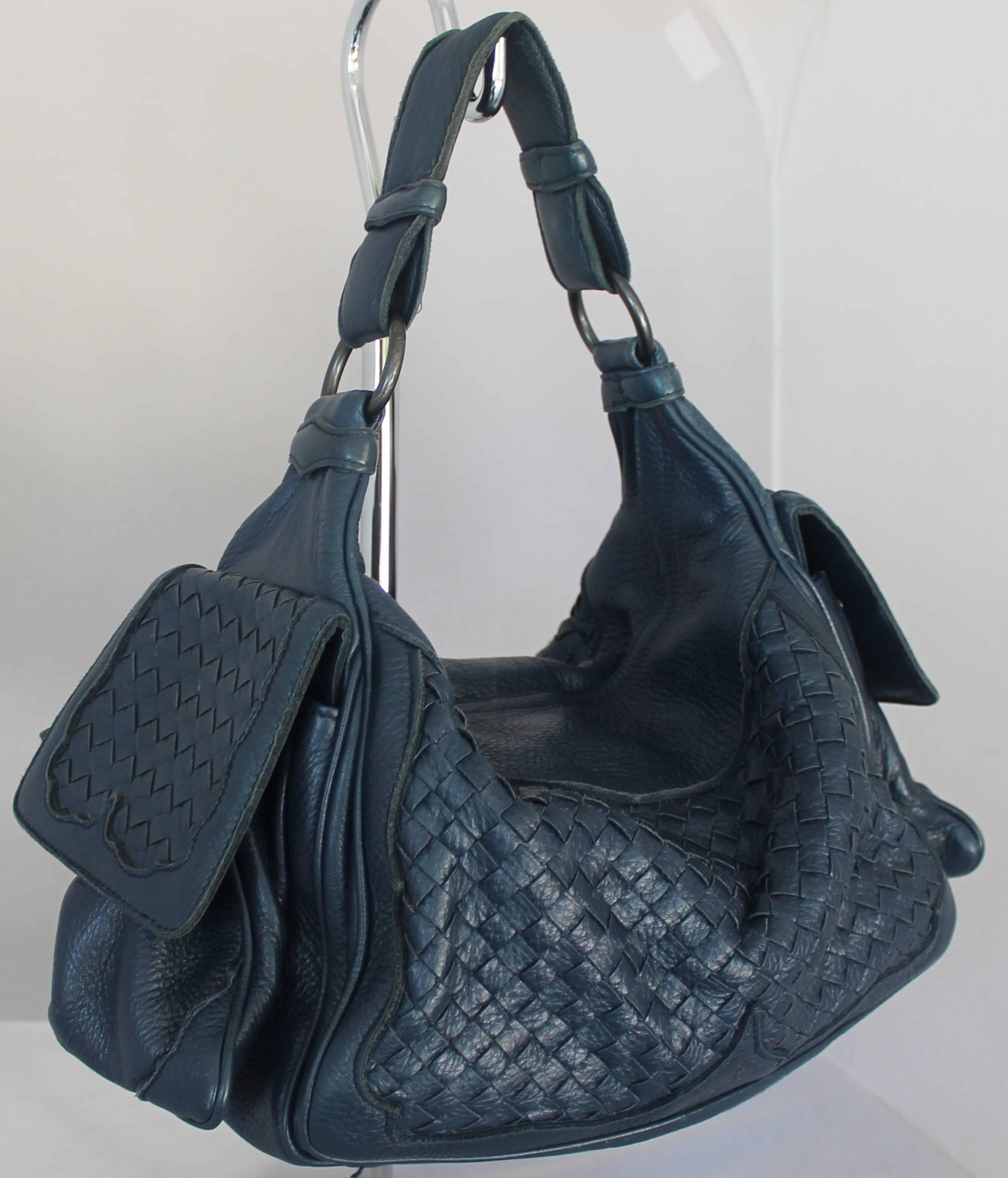 Bottega Veneta Navy Woven Leather Large Shoulder Bag .  This bag is in fair condition with some wear on the handle, inside line, and the leather in general.  It comes with a duster and it features two side pockets on the outside as well as a