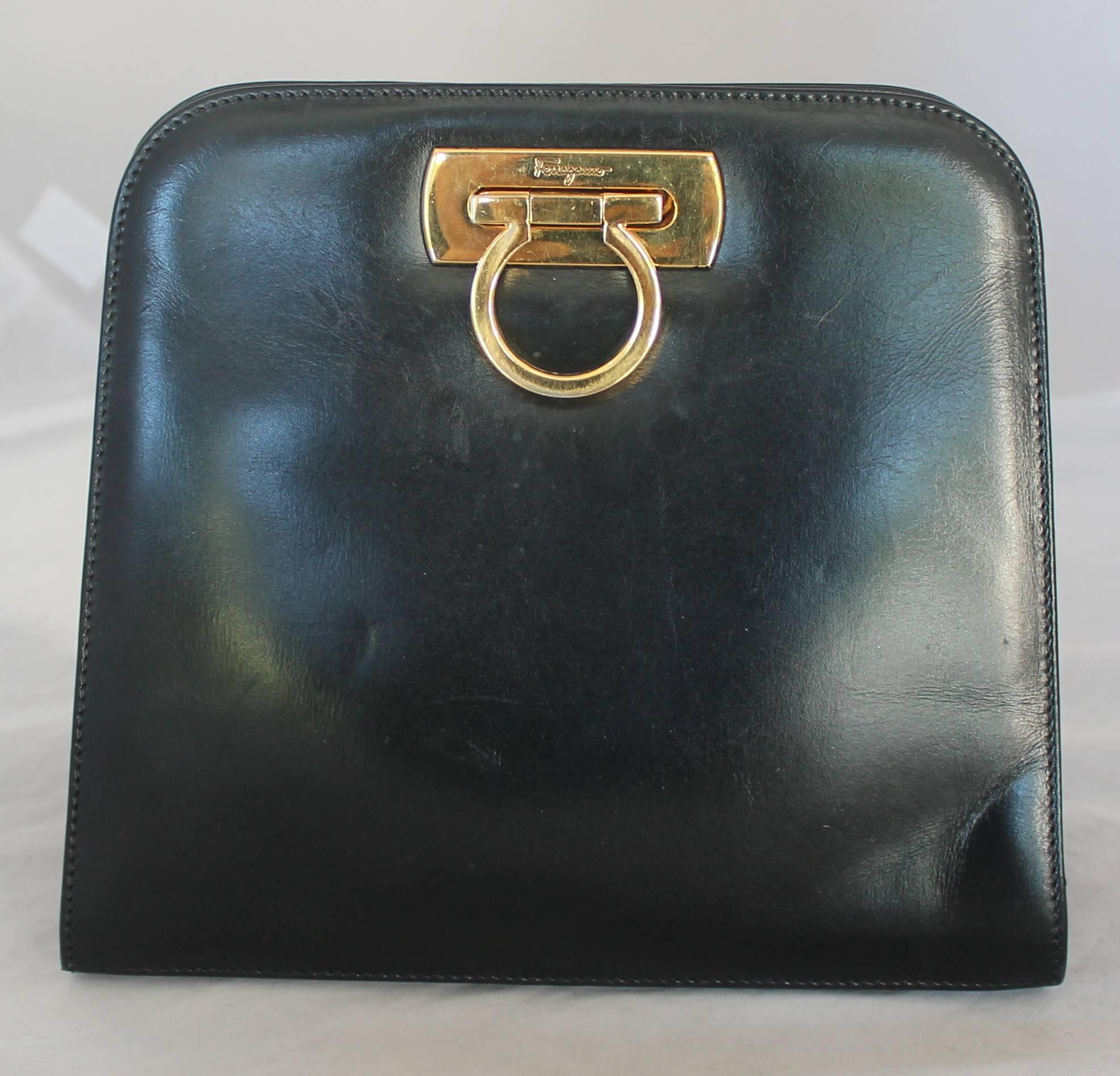 Salvatore Ferragamo 1980's Black Leather Square Clutch/Cross Body Bag - GHW.  This vintage bag is in very good condition having only a few marks on it.  It can be used as a clutch or worn as a cross body or shoulder bag with its beautiful gold link