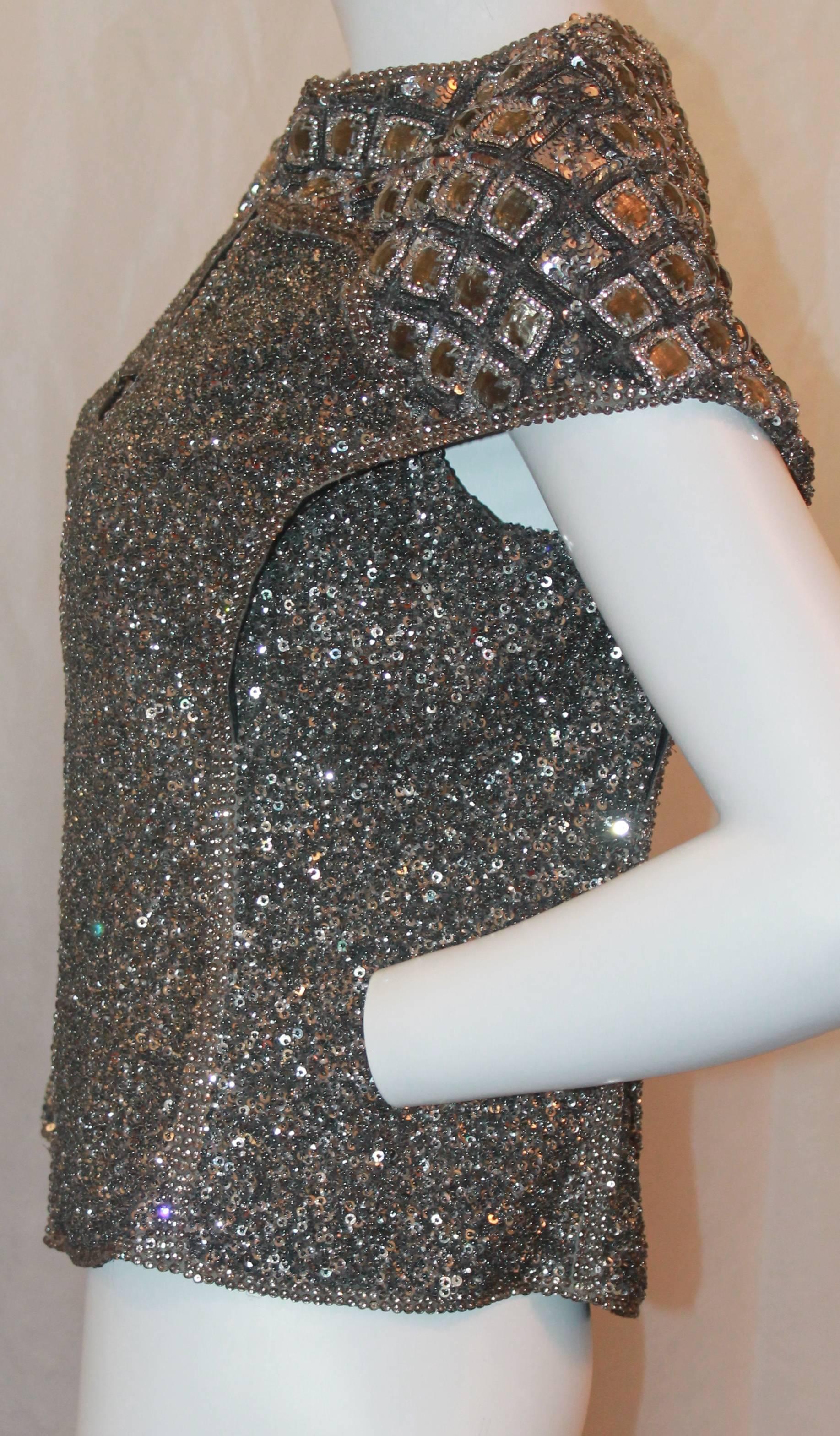 Escada Heavily Beaded gunmetal  Top w/ Satin Sash - 38 - NWT.  This stunning top is in excellent condition.  It is very heavily beaded with a front zipper down the center front.  It has a geometric cut with two front panels.  This top includes a