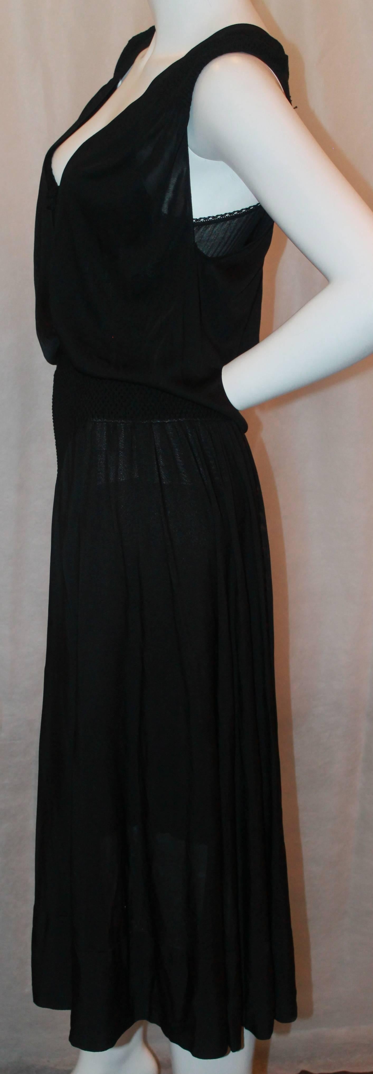 Chanel Black Silk Knit Dress w/ slip knit slip - 2008 - 42 - NWT.  This dress and slip set is in excellent condition.  The dress is a bit sheer; it has a deep 