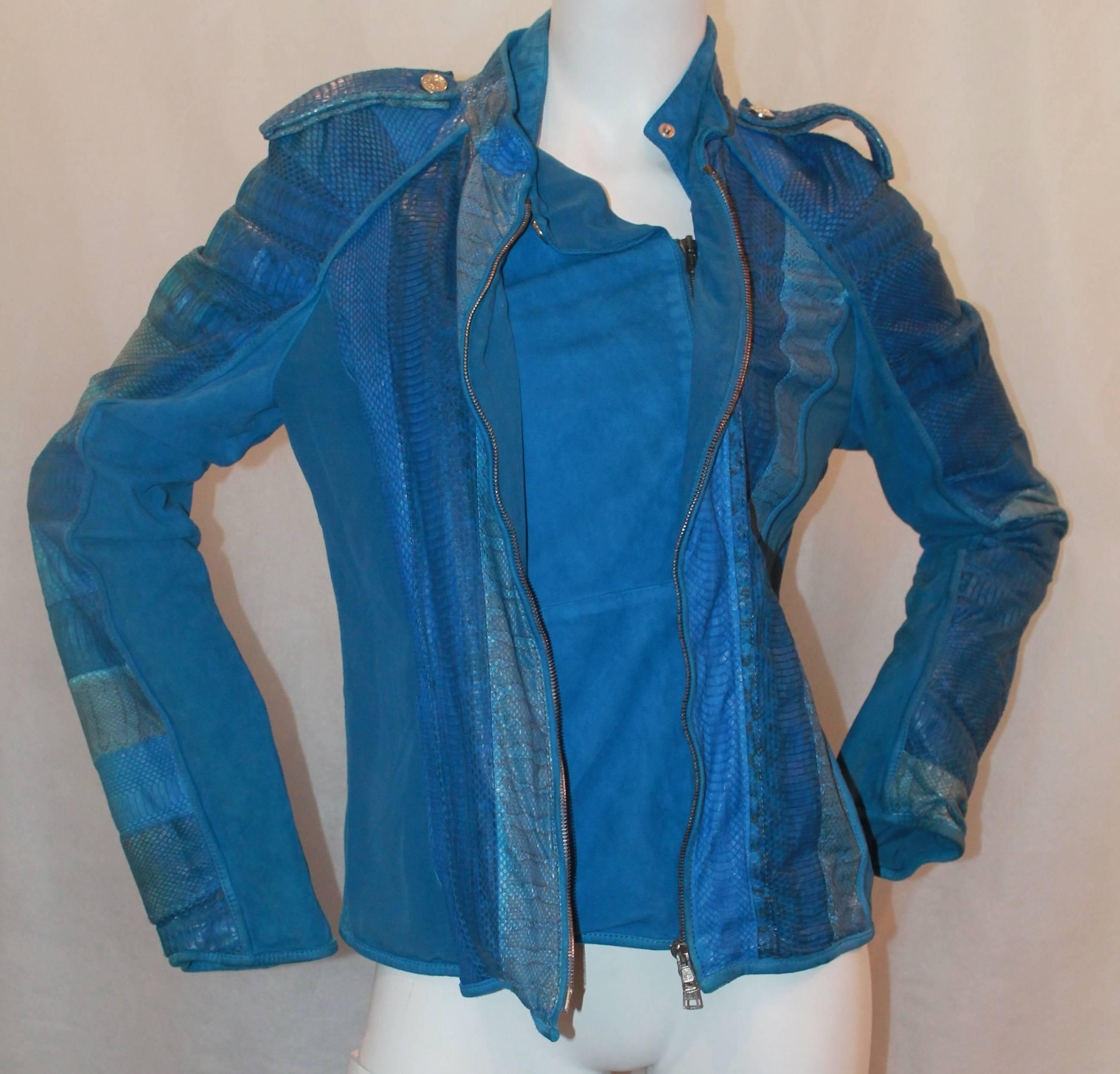 Roberto Cavalli Blue Silk, Snake, & Suede Jacket - 42.  This jacket is in excellent condition.  It features multi blue snake skin, sued under the sleeves, and a silk lining.  It has a double zipper with a multi layered front and a neck