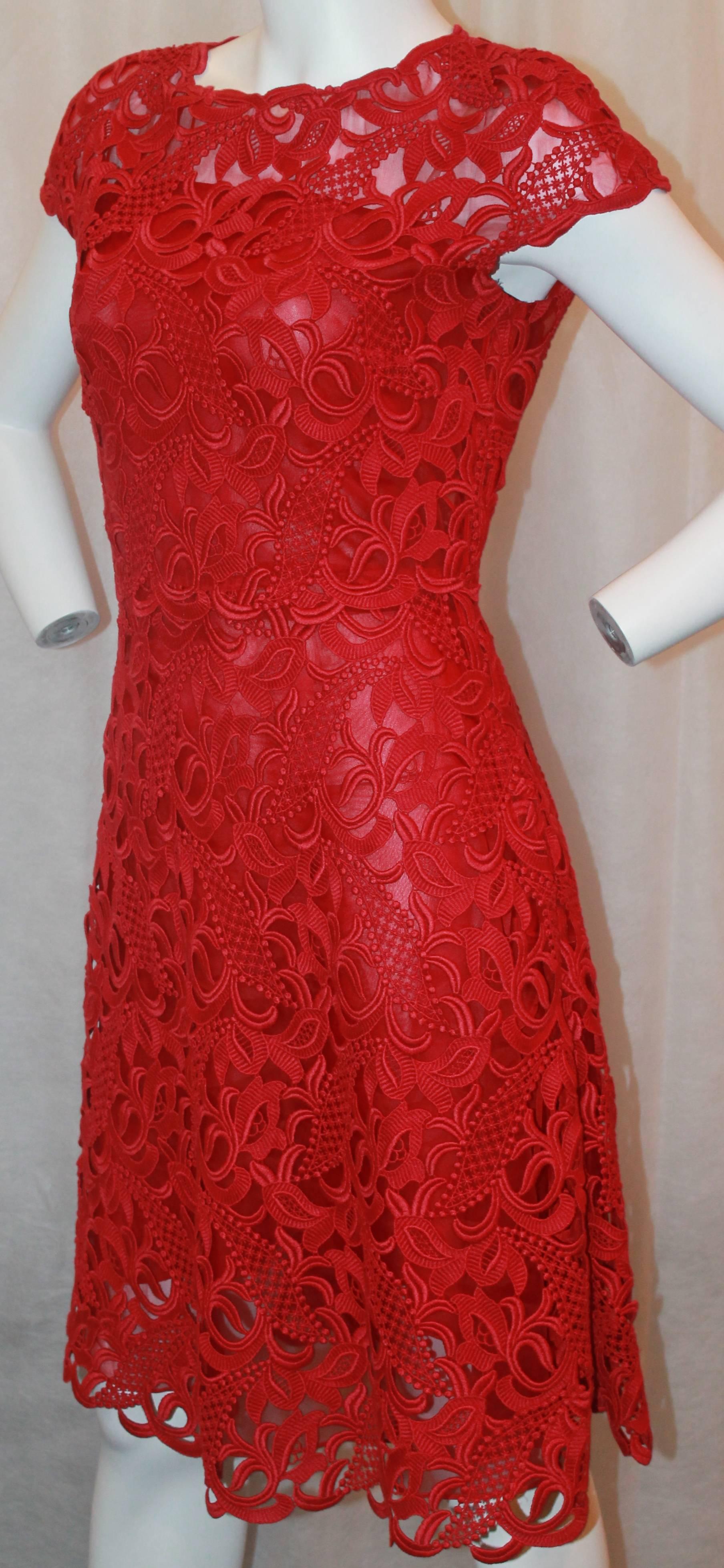 Valentino Red Soutache Lace Dress  - Small.  This stunning dress is in excellent condition.  It features an elegant and intricate soutache lace, short sleeves, round neckline, fitted torso, A-line skirt and a silk slip underneath.  It is very