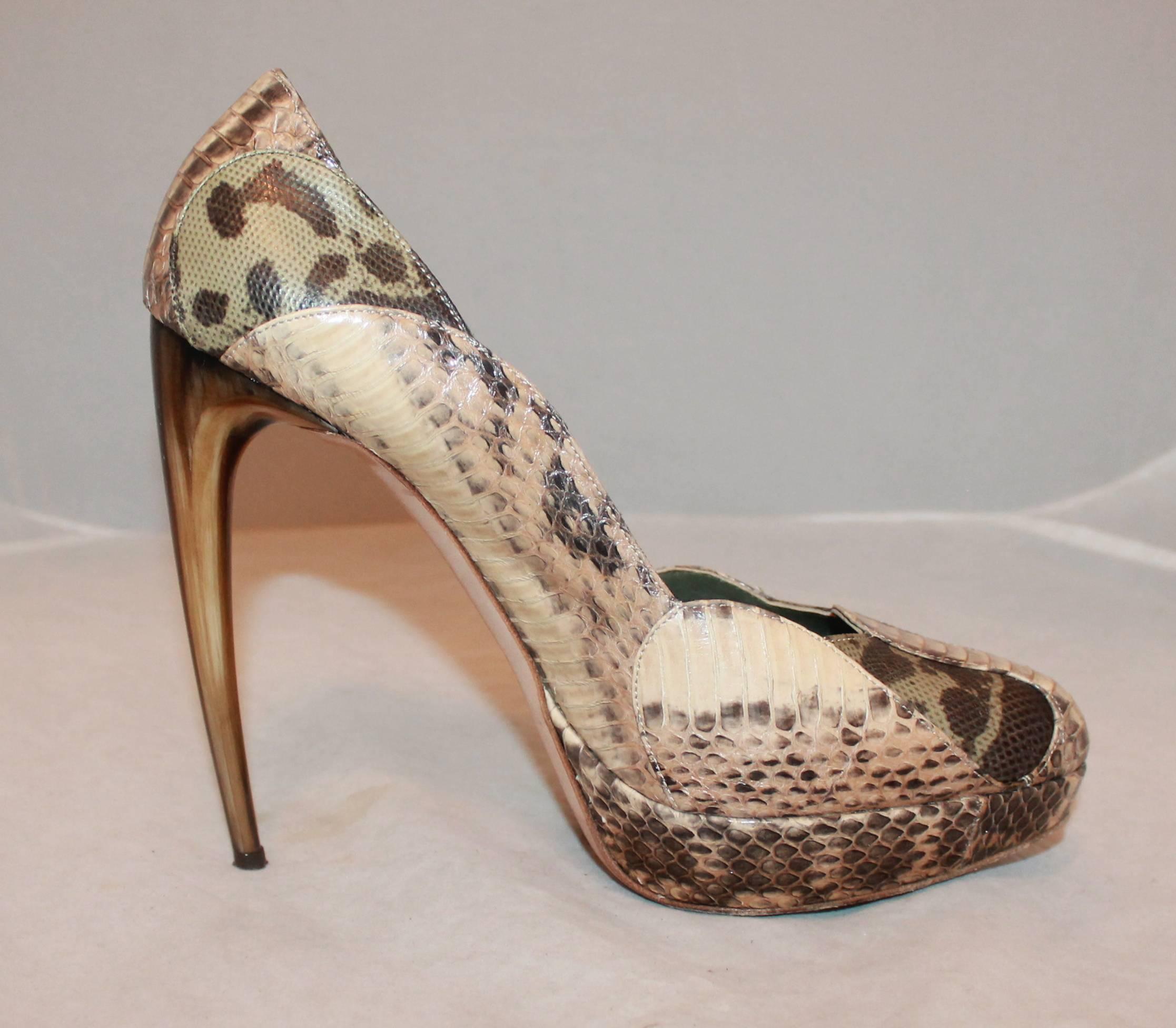 Alexander McQueen Earthtone Snake Skin & Lizard Patchwork Pumps - 41.  These exquisite pumps are in very good condition with only some wear and slight scuffing to the heel, and wear on the bottom of the shoe.  These unique Alexander McQueen Pumps