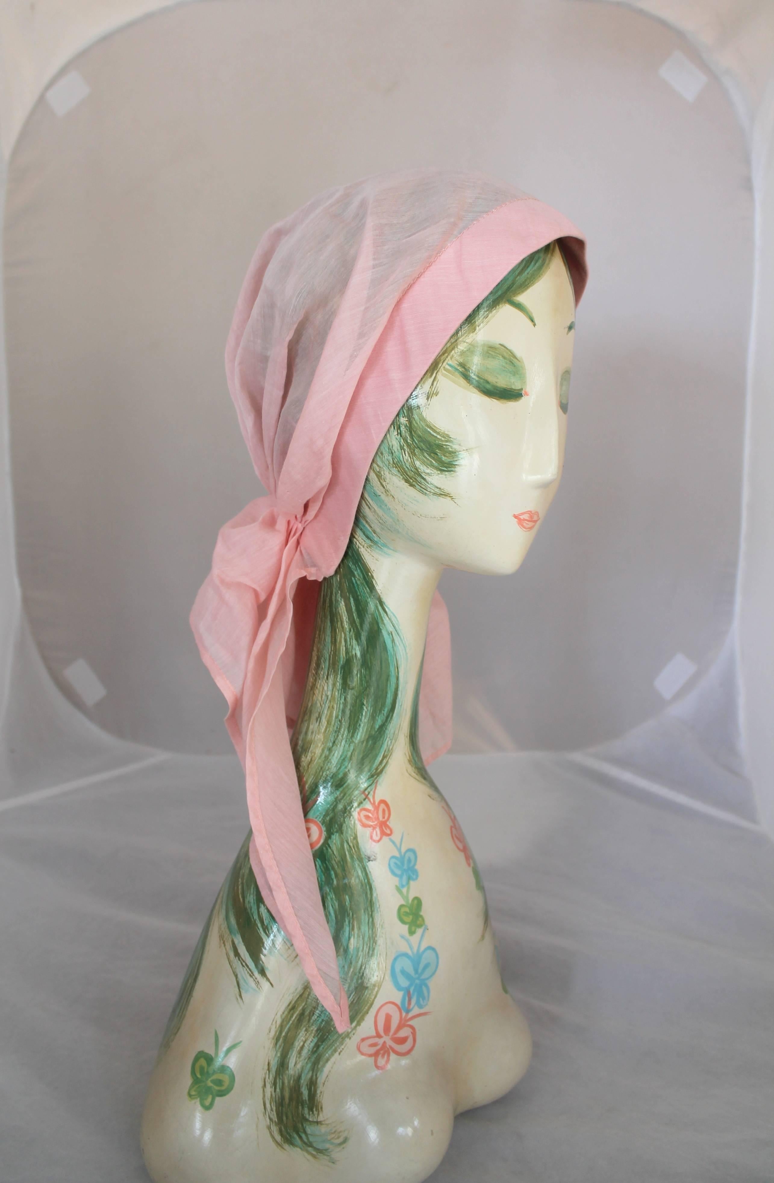 Chanel Pink Cotton Sheer Turban Hat - circa 1980's. This piece is in excellent vintage condition and is the perfect piece for spring! It fits around the head and bunches up at the base of where the head would be and drapes down at different lengths.