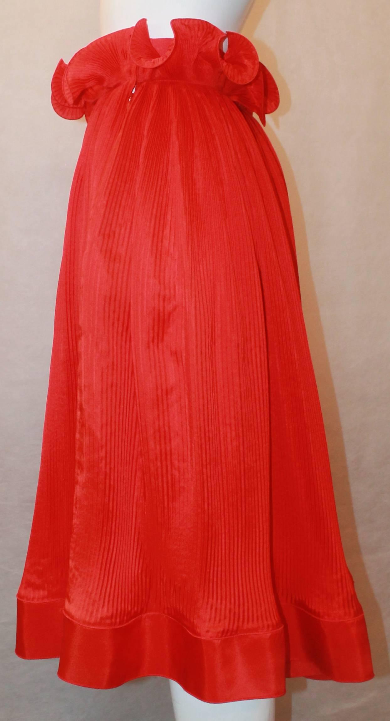 Stella McCartney Red Silk Pleated Skirt with Top Gathering - 40. This skirt is in excellent condition and has a side zipper. It is mid-length with s bottom plain trim & gatherings at the top waist that have a swirling look. It has a very slight