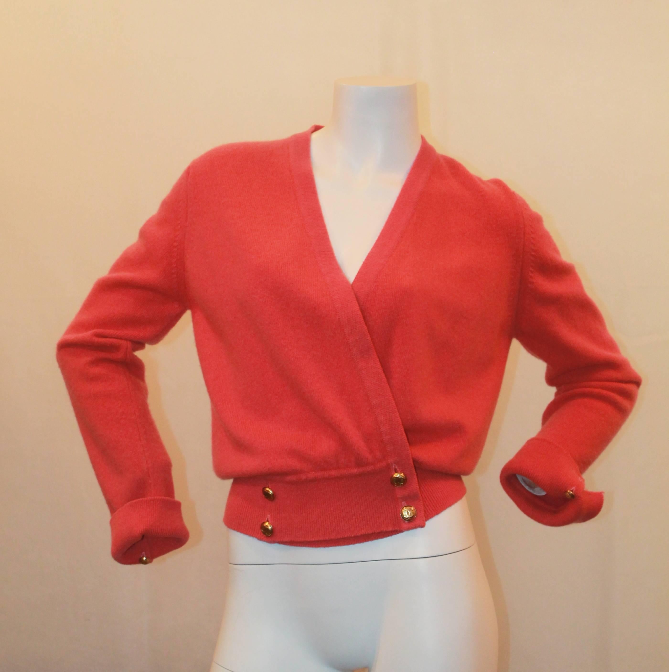 Chanel Vintage Coral Cashmere Cardigan w/ Cinched Bottom - circa 1980's - M.  This beautiful Chanel cardigan is in good vintage with pilling visible throughout.  It features a double breasted appearance, gold 