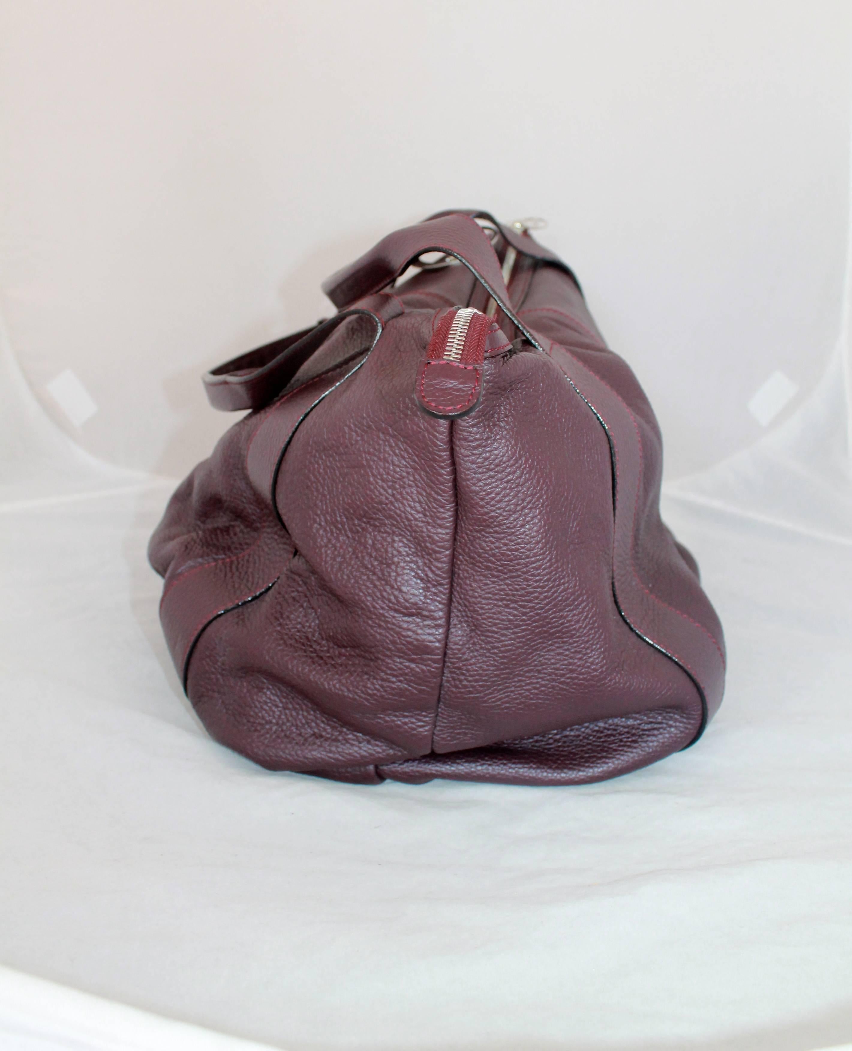 A. Testoni Eggplant Deerskin Leather Shoulder Bag - SHW. This bag is in excellent condition and comes with a duster. 

Measurements:
Height- 12.5