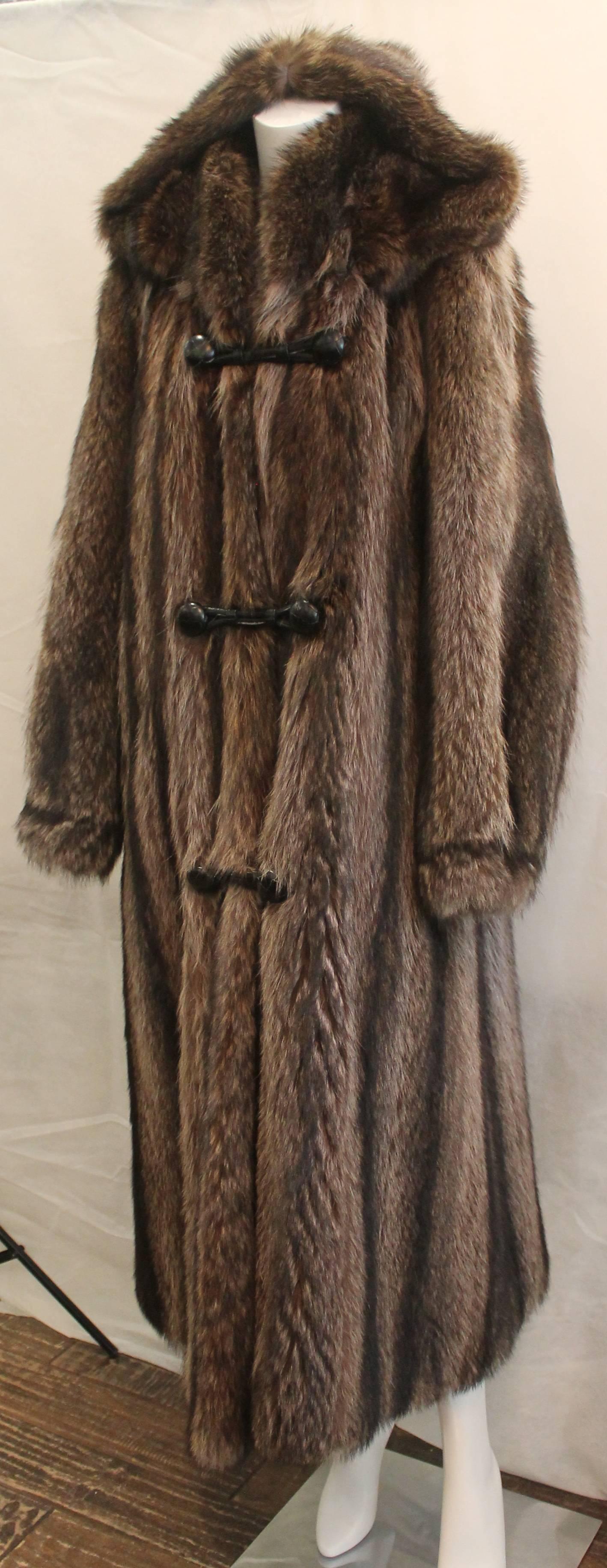 Custom Montgomery Style Hooded Brown Raccoon Full Coat - M. This piece is in excellent condition with the hood being detachable. It has front buttons with closure straps. 

Measurements:
Bust- 44