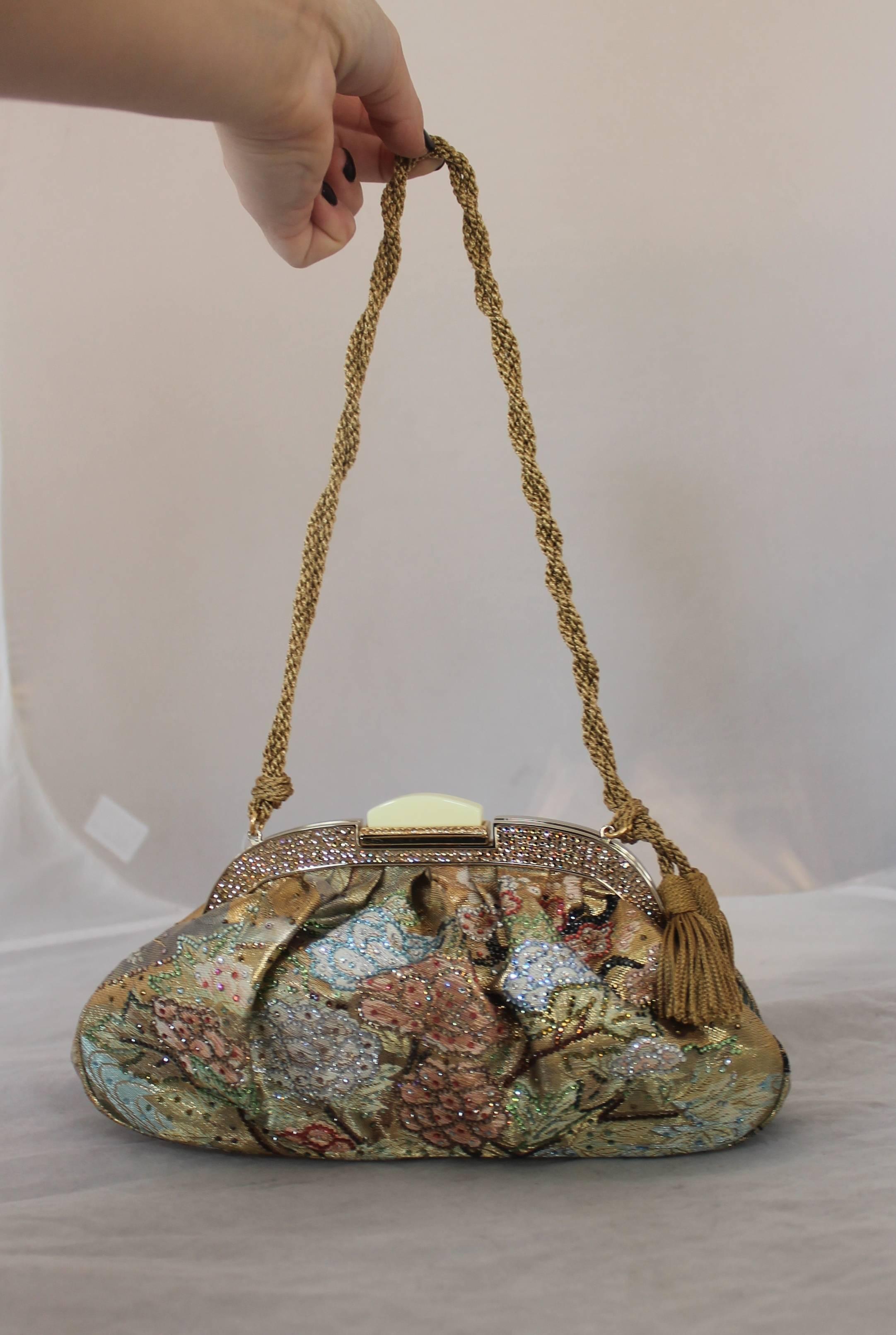 Judith Leiber Collector's Edition Multi Pastels Brocade Bag with Rhinestone Flowers & Rope Strap and tassel. This piece is in excellent condition still has the original tag attached. It comes with a duster and booklet. The lining is also a deep